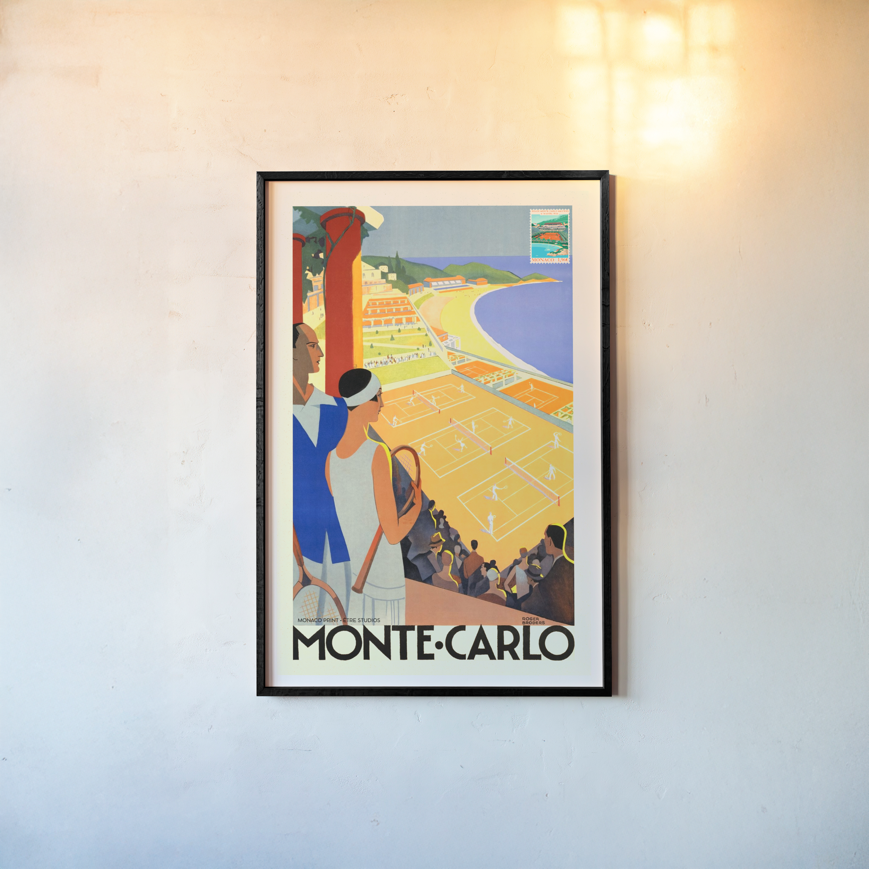 Framed poster of a tennis scene with the text "Monte Carlo" written at the bottom