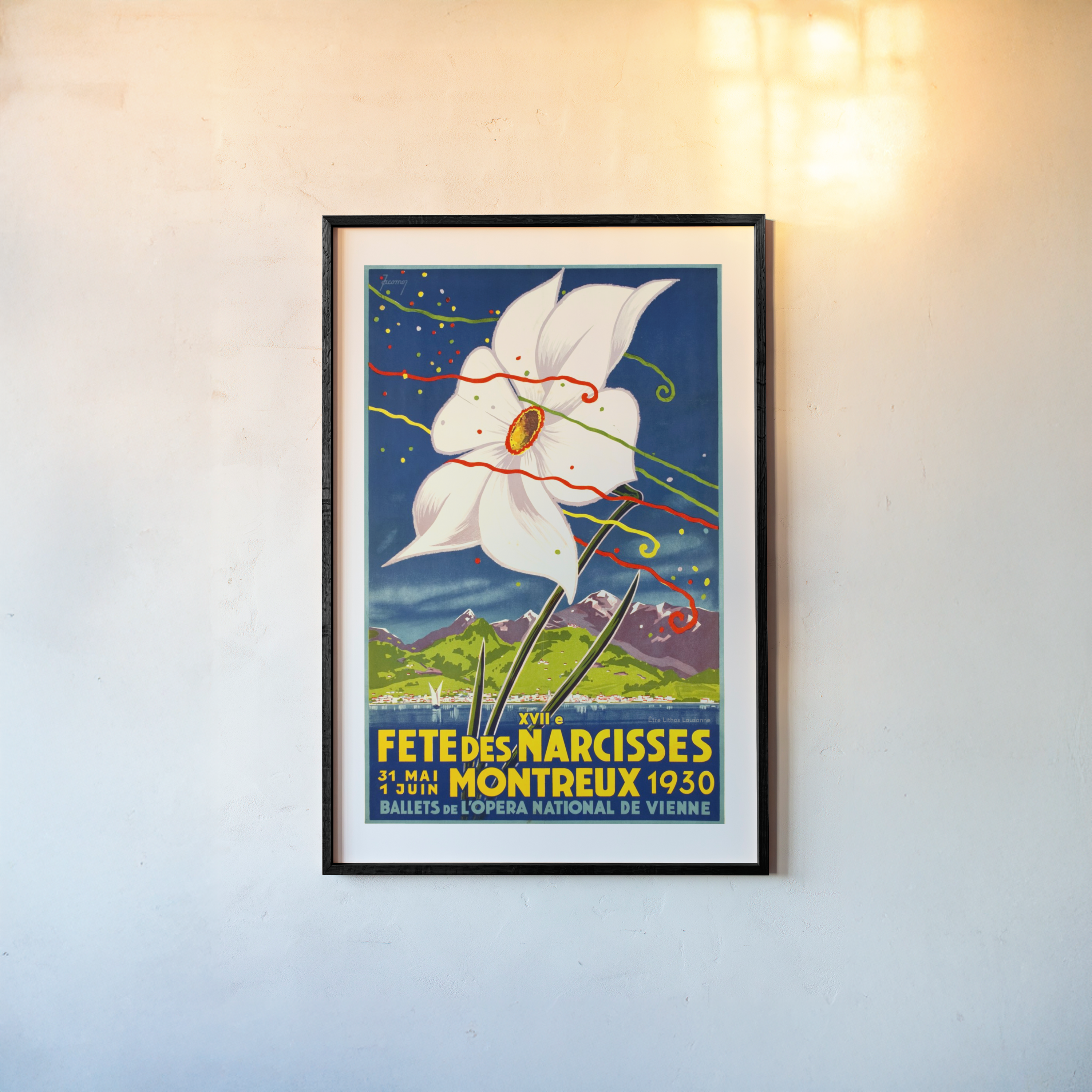 Framed artwork featuring a large white flower on top of a serene mountain landscape hanging on a light background