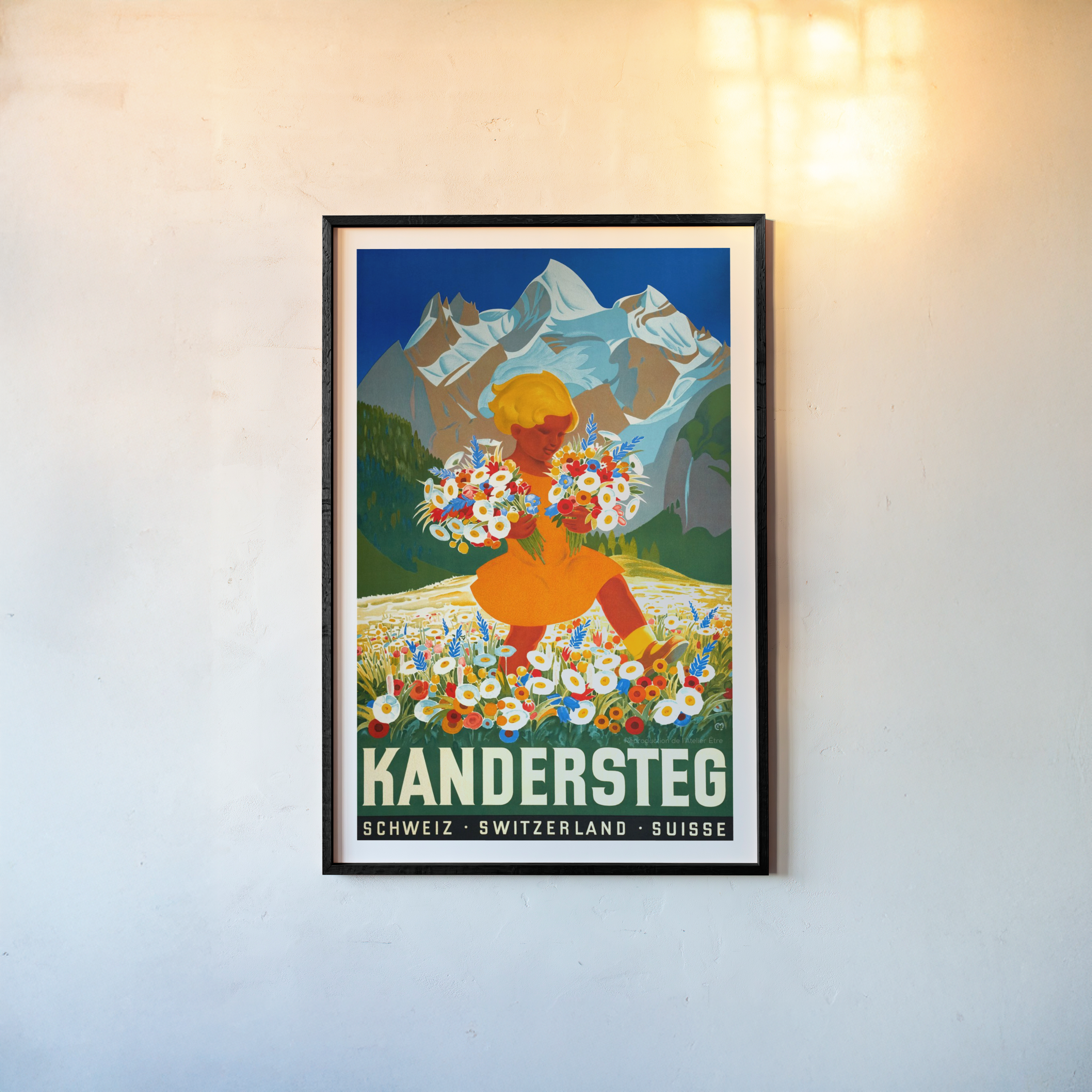 Framed poster of "Kandersteg" featuring mountains and a girl carrying flowers