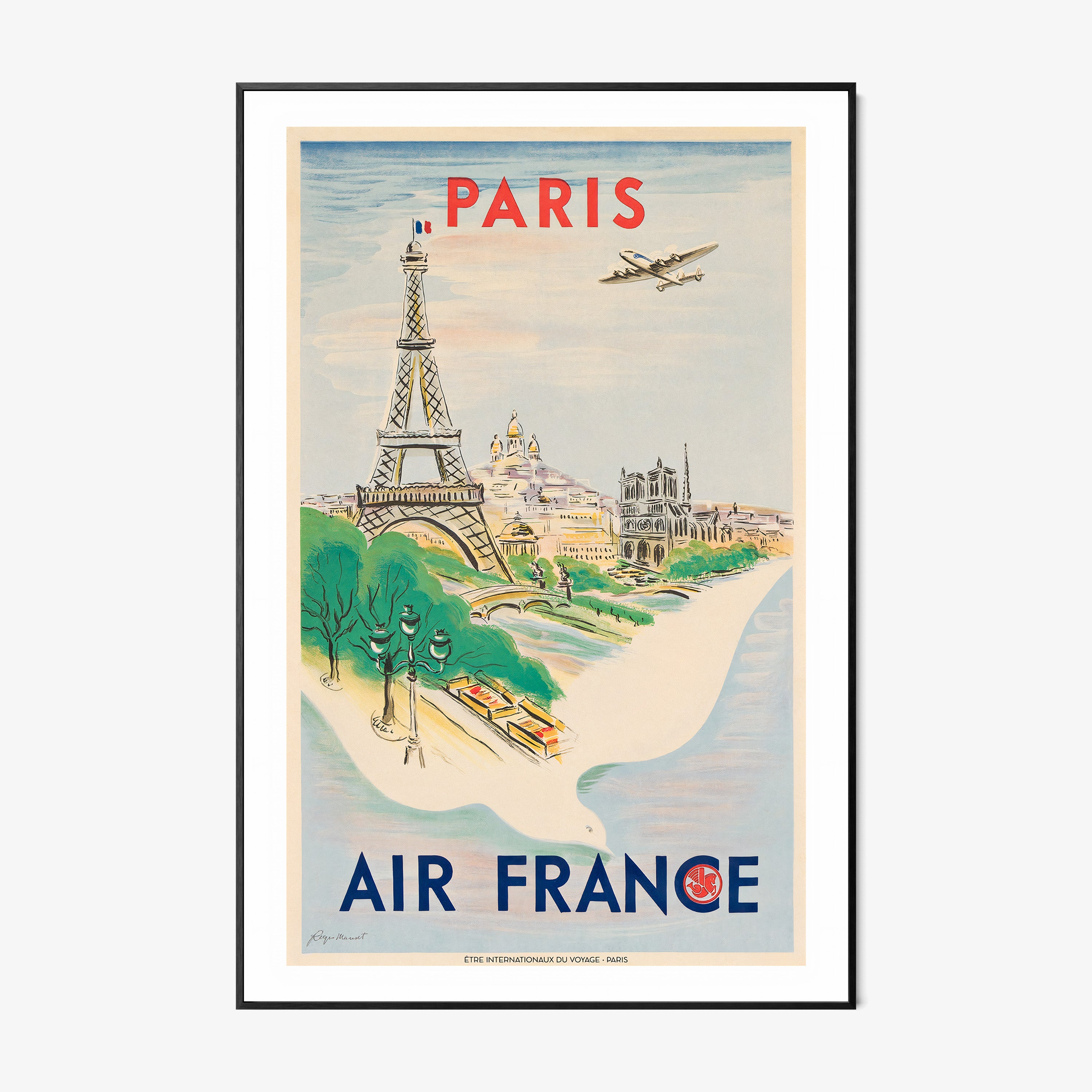 Framed Air France poster of Paris on a wall