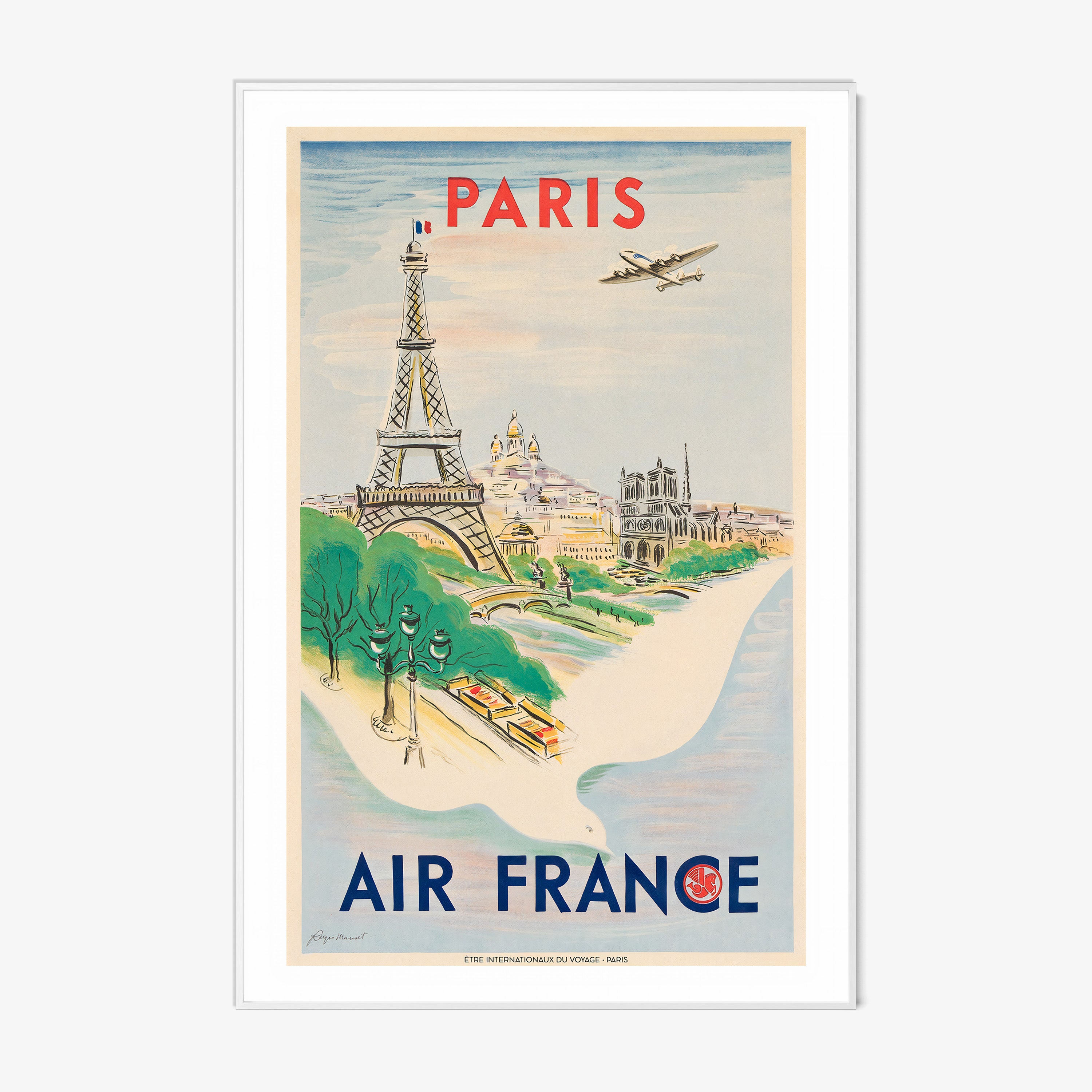 Framed Air France poster of Paris on a wall