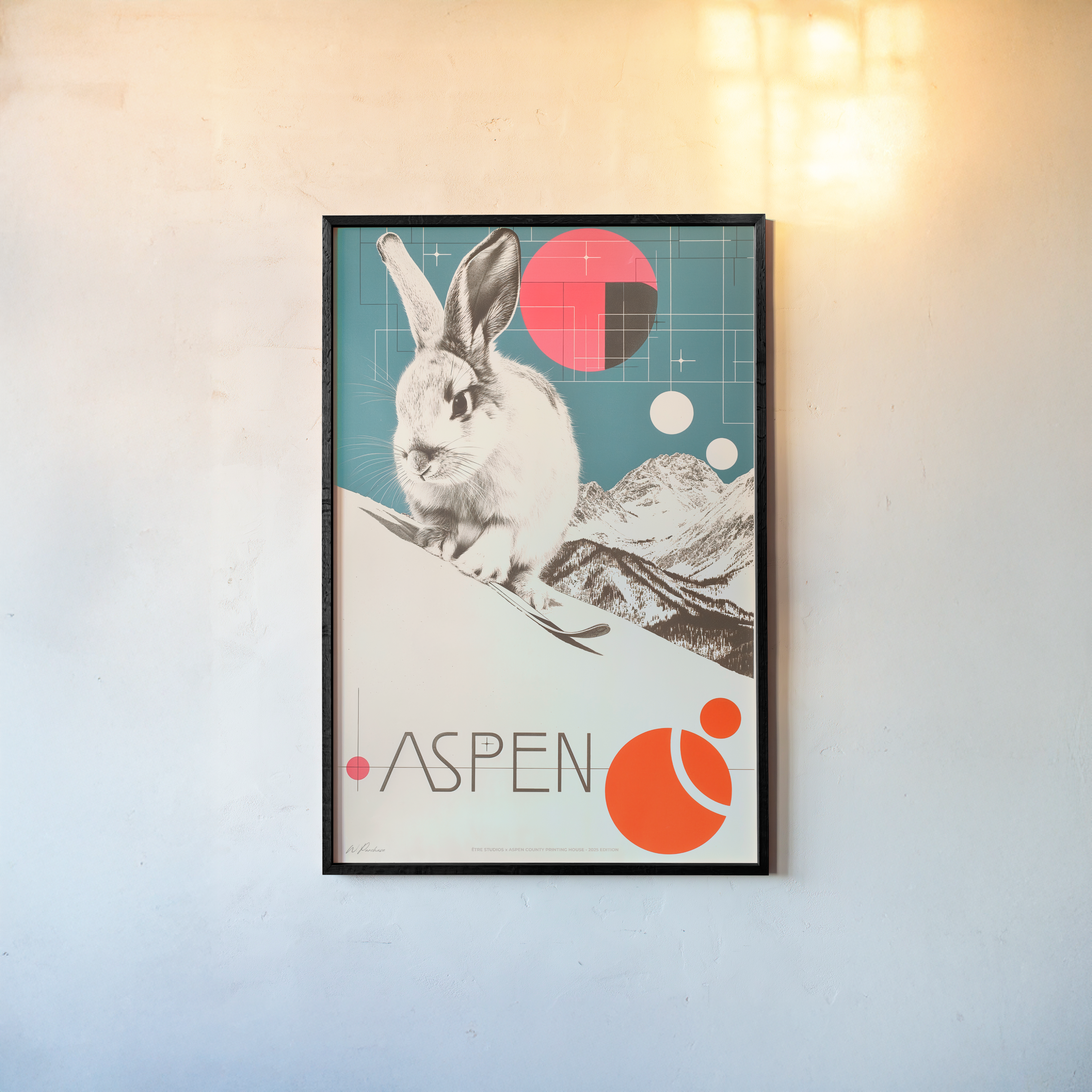 Framed poster of a rabbit on a ski slope with the text "Aspen" written out at the bottom
