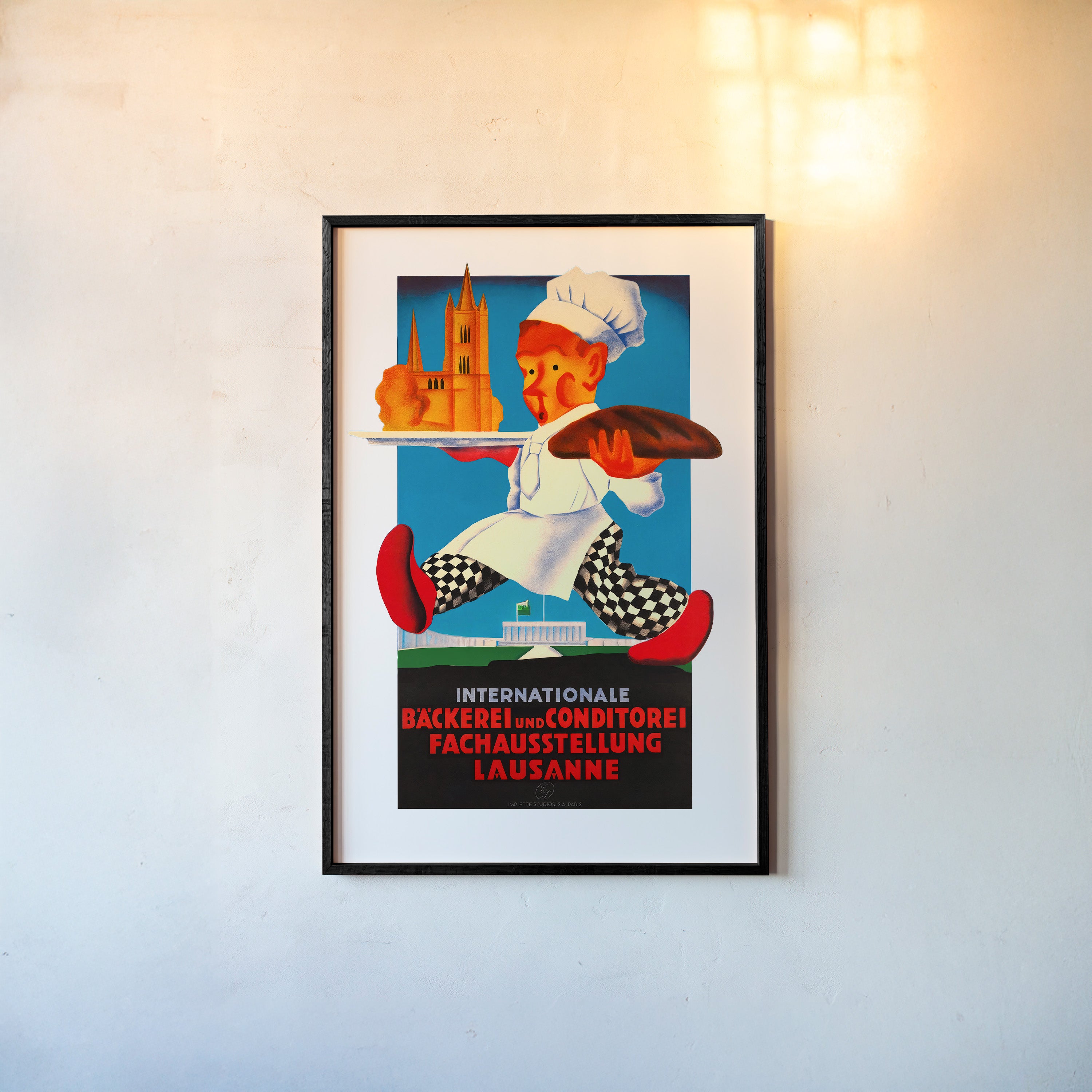 A framed poster features a whimsical chef with a bold art style