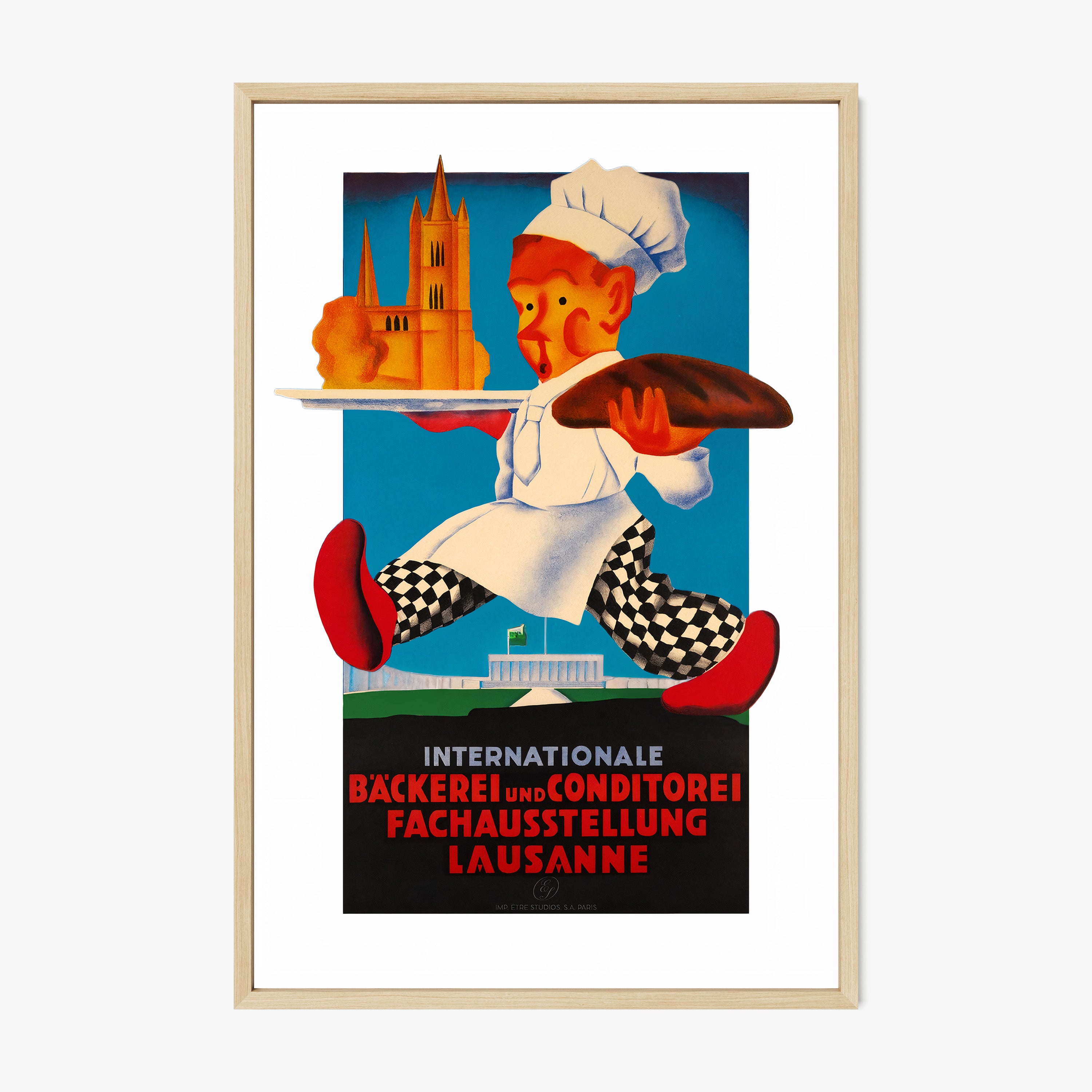 A framed poster features a whimsical chef with a bold art style