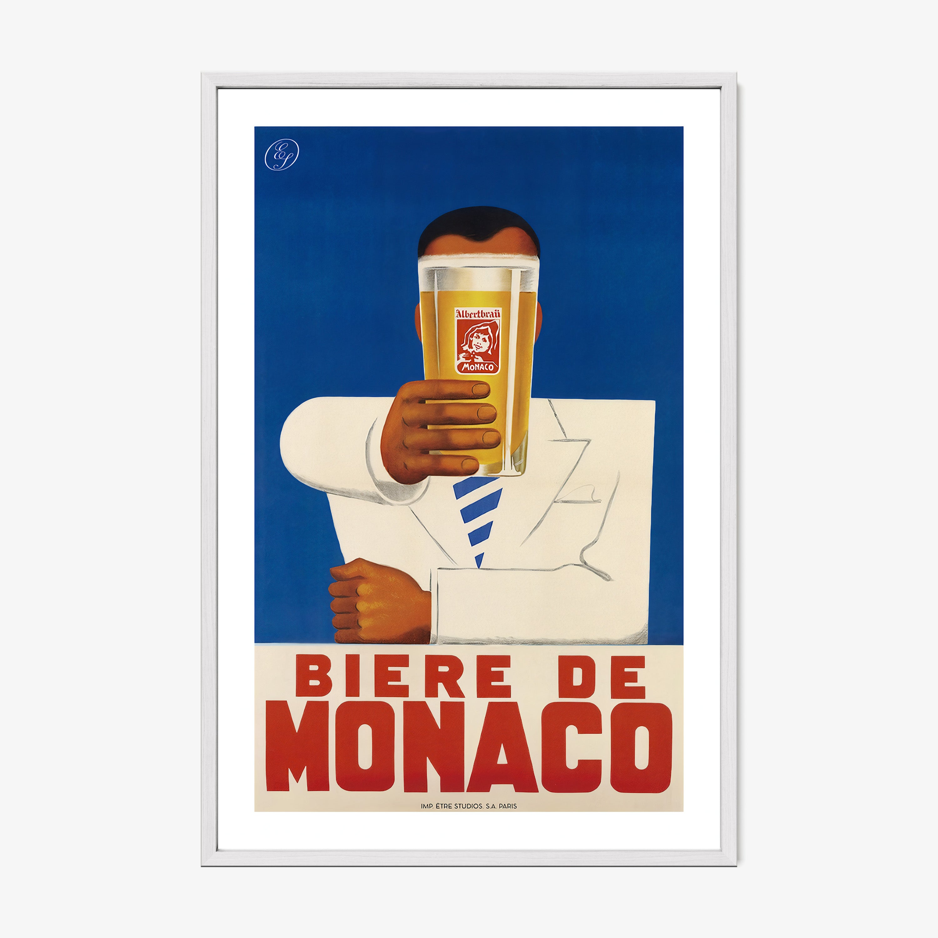 A framed poster features a person holding a beer with bold text "Biere De Monaco"