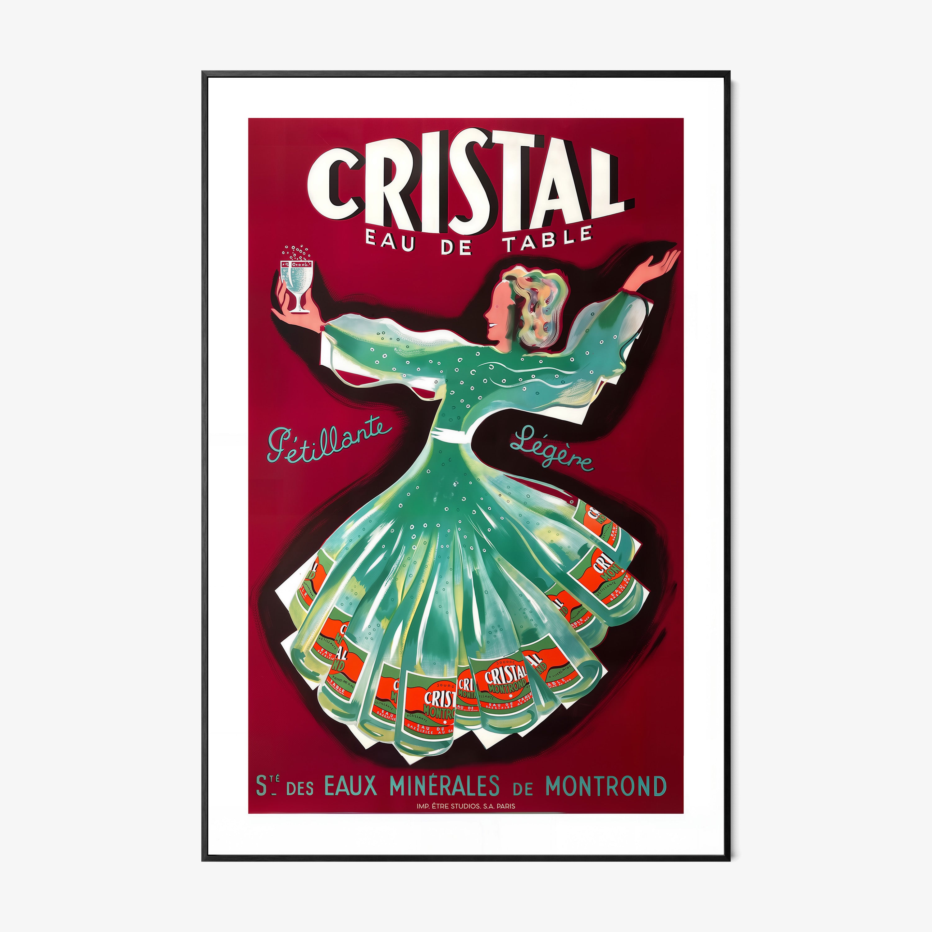 A framed poster features a whimsical woman dancing holding a glass of cristal