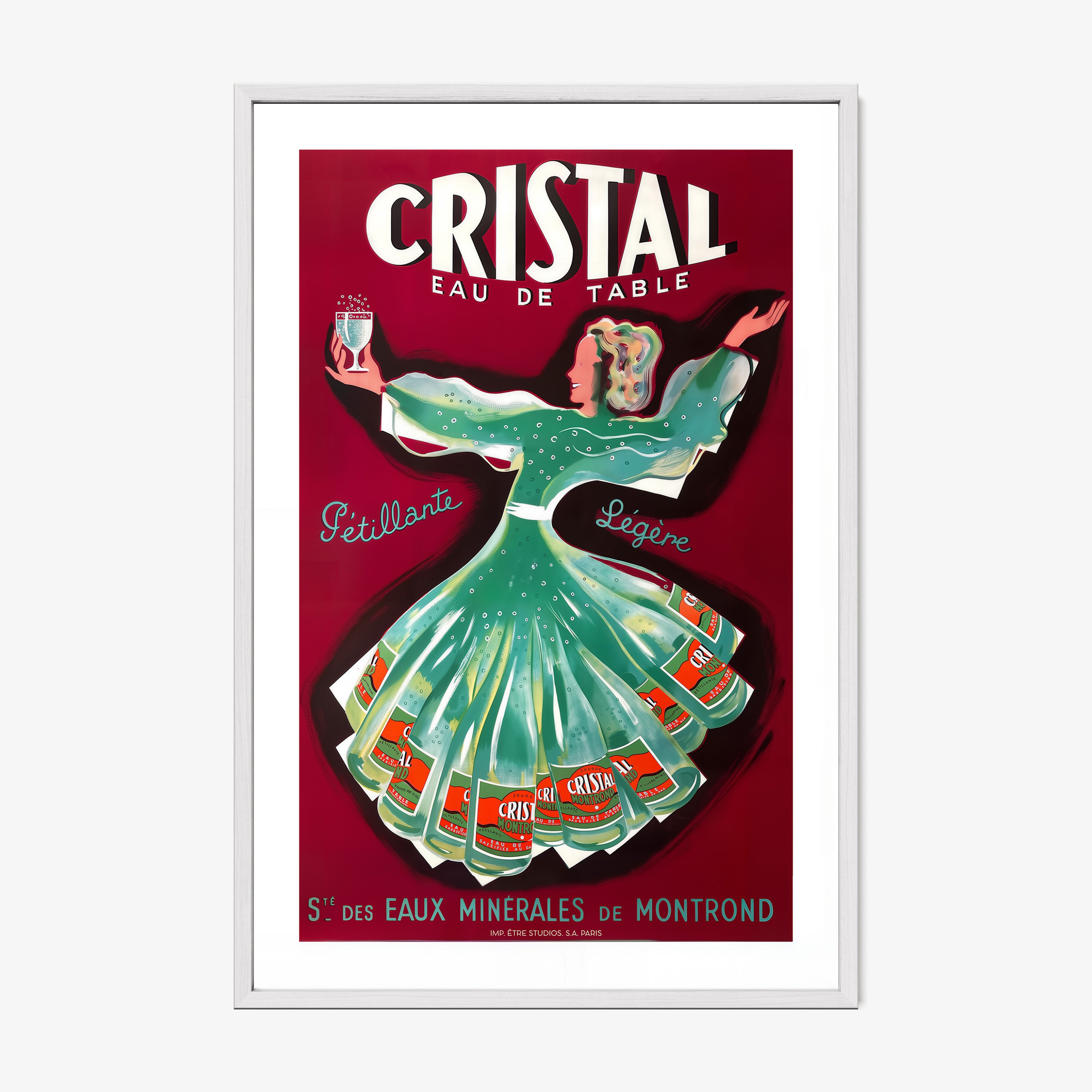 A framed poster features a whimsical woman dancing holding a glass of cristal