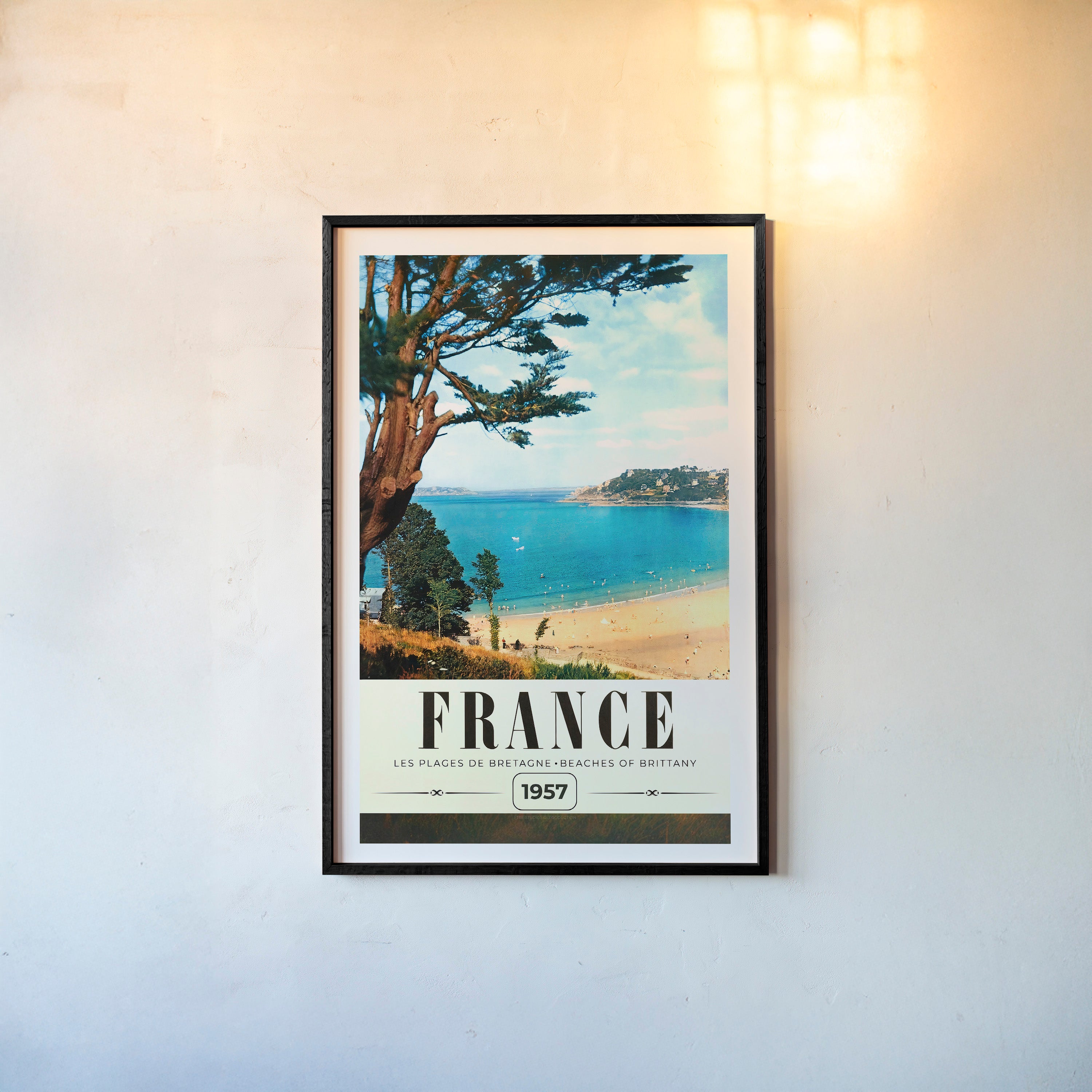 Poster of a beach with the text "France" on a light background