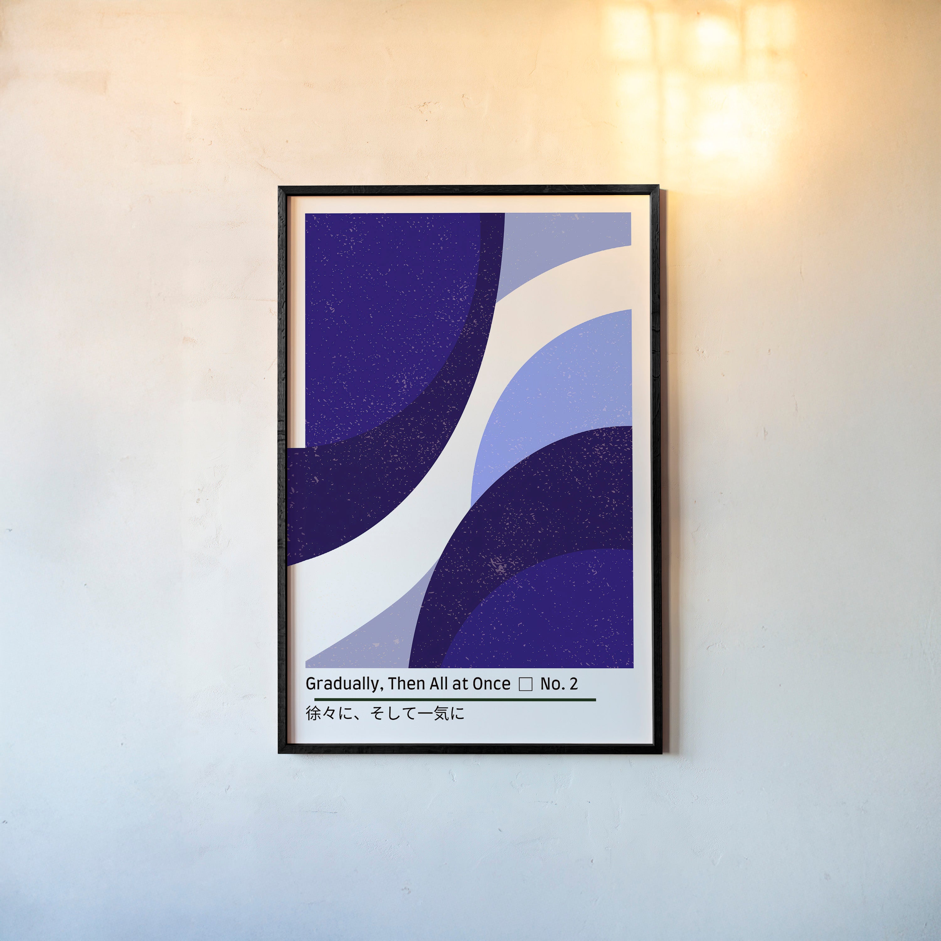 Framed poster of abstract blue figures hanging on a light background