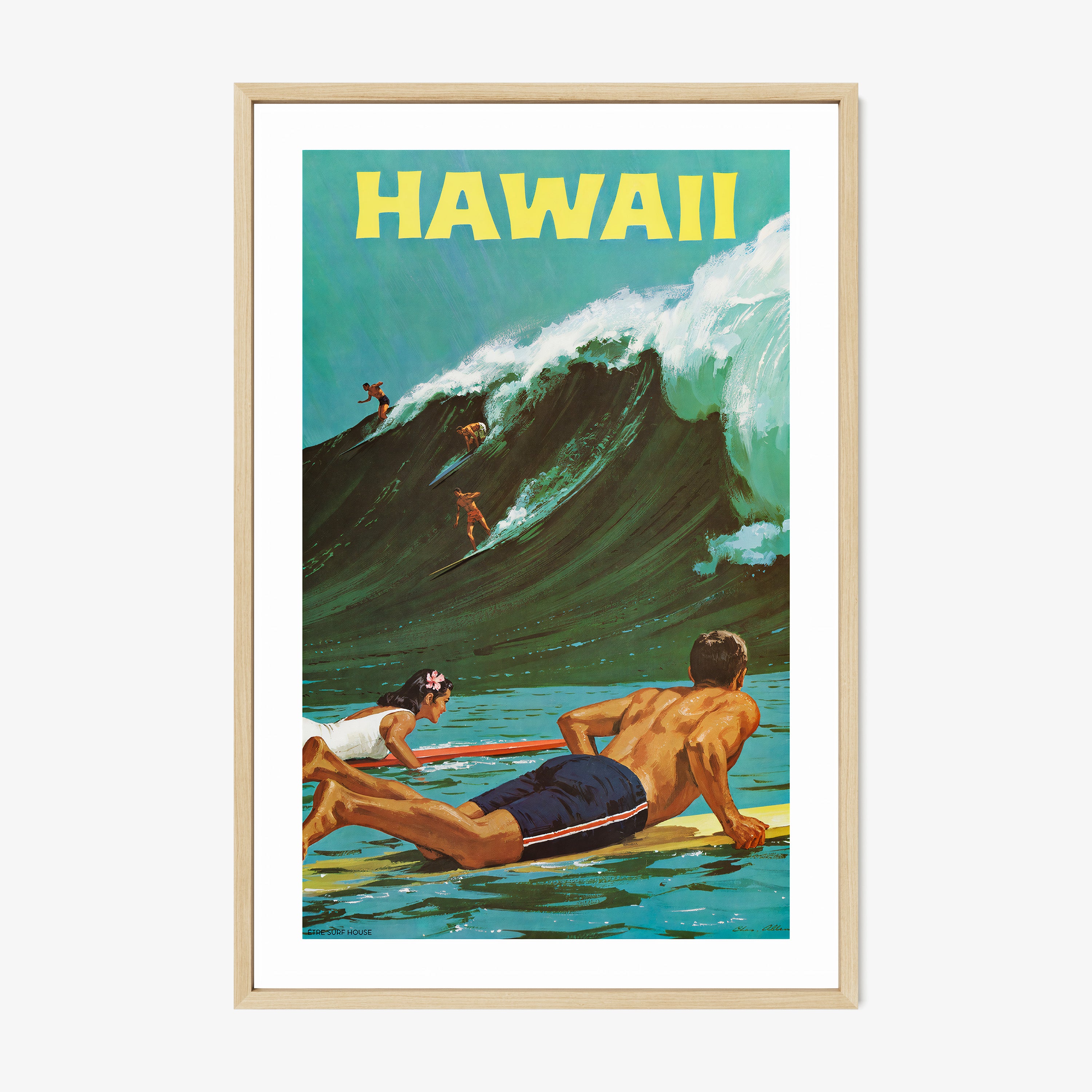 Framed "Hawaii" poster featuring surfers on a big wave hanging on a light background
