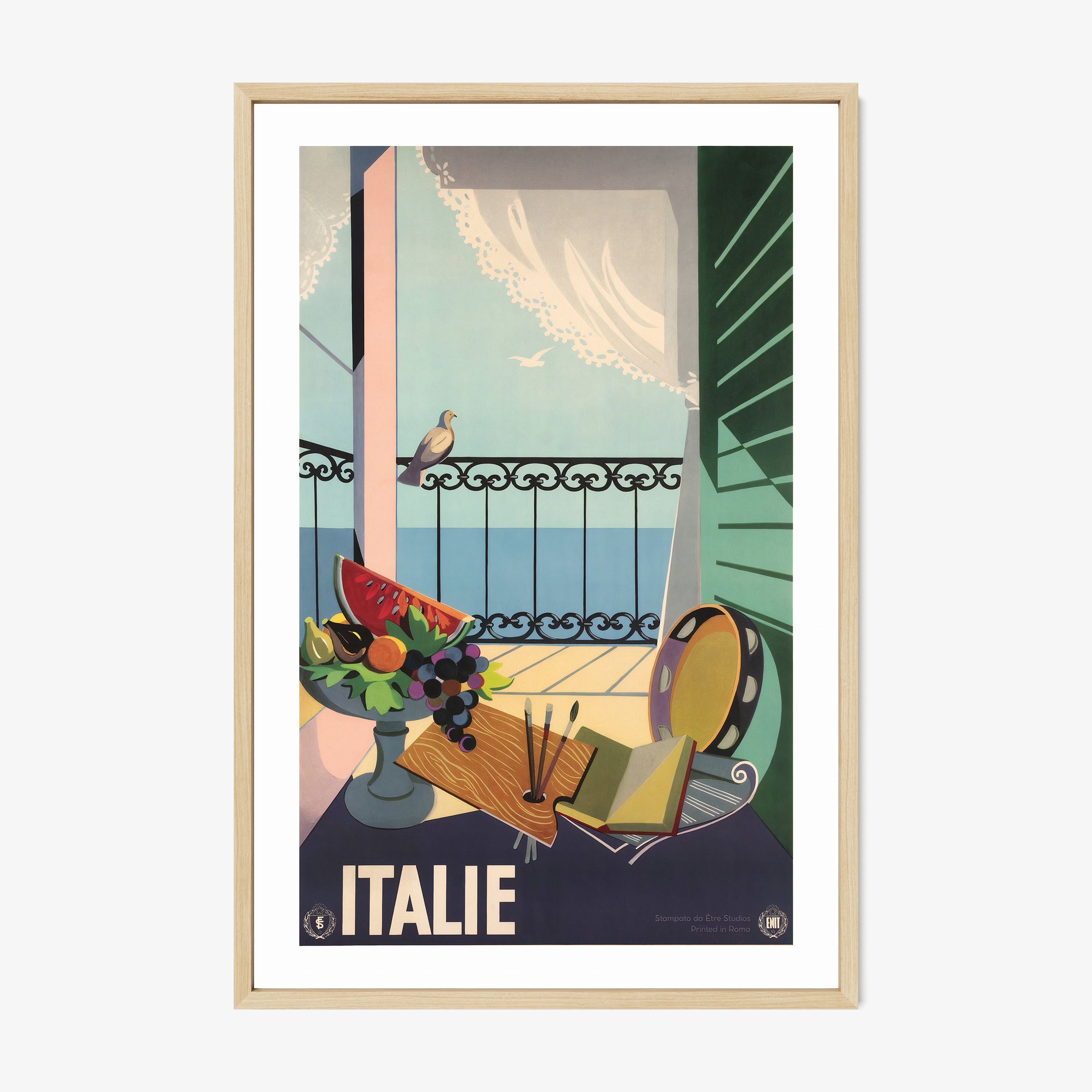 Framed poster of porch scene surrounded by artistic materials with the text "Italie" at the bottom hanging on a light background
