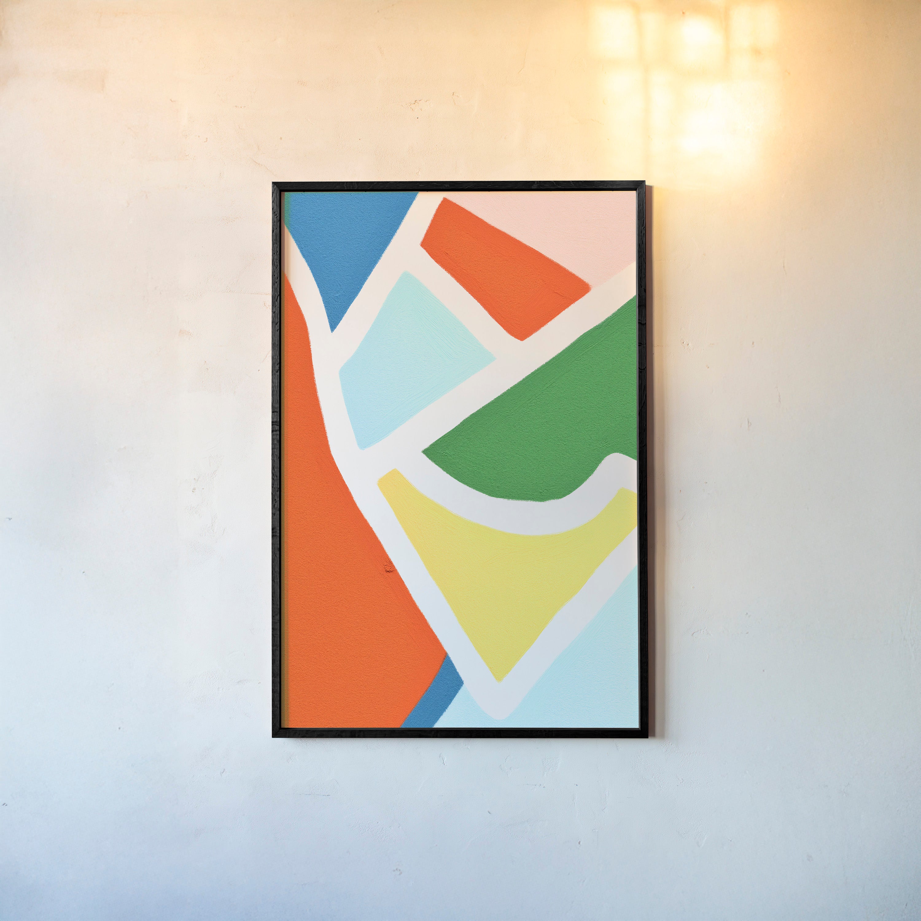 Abstract color pattern on a framed poster hanging on a light background