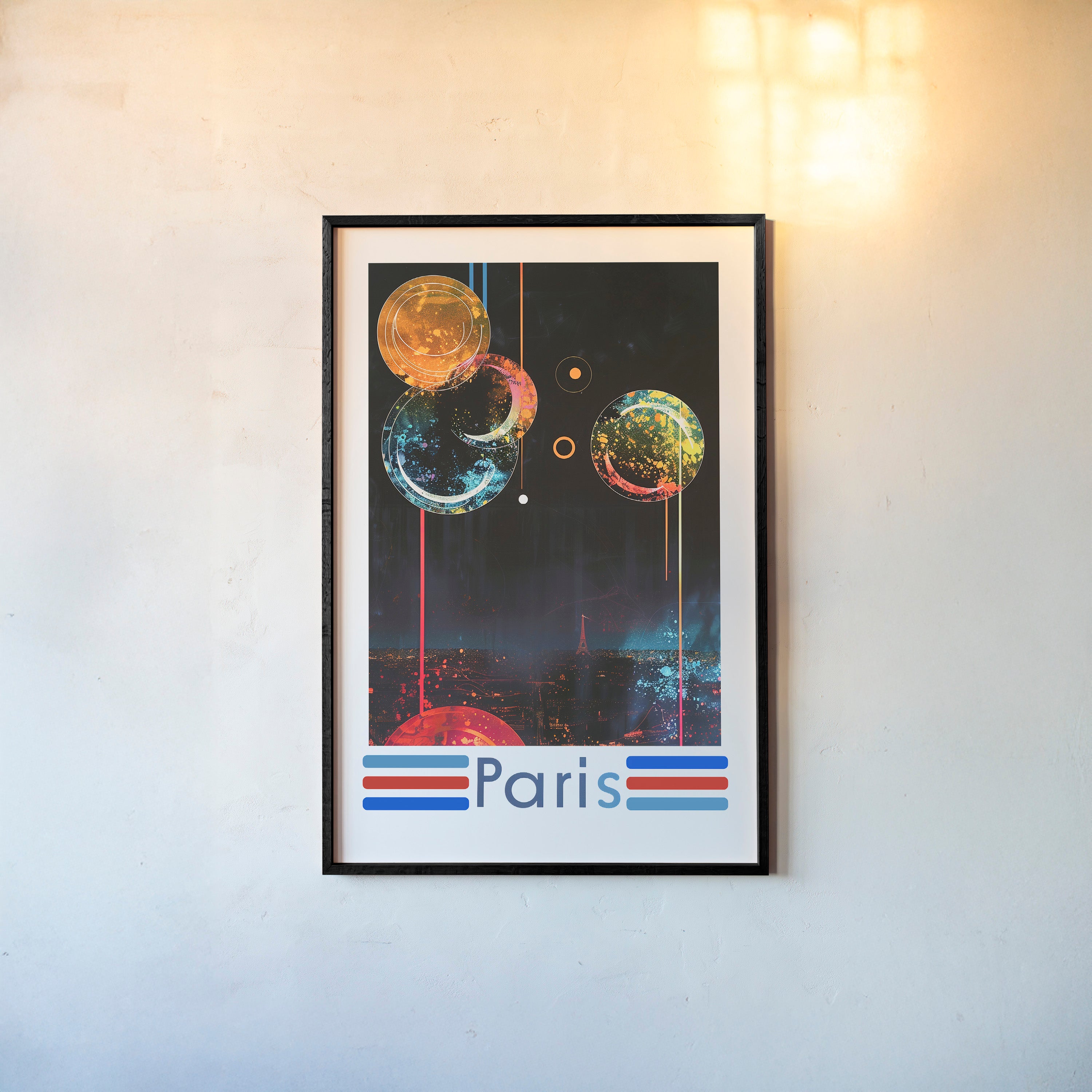 Framed poster of a colorful nighttime scene over Paris on a wall with a light background