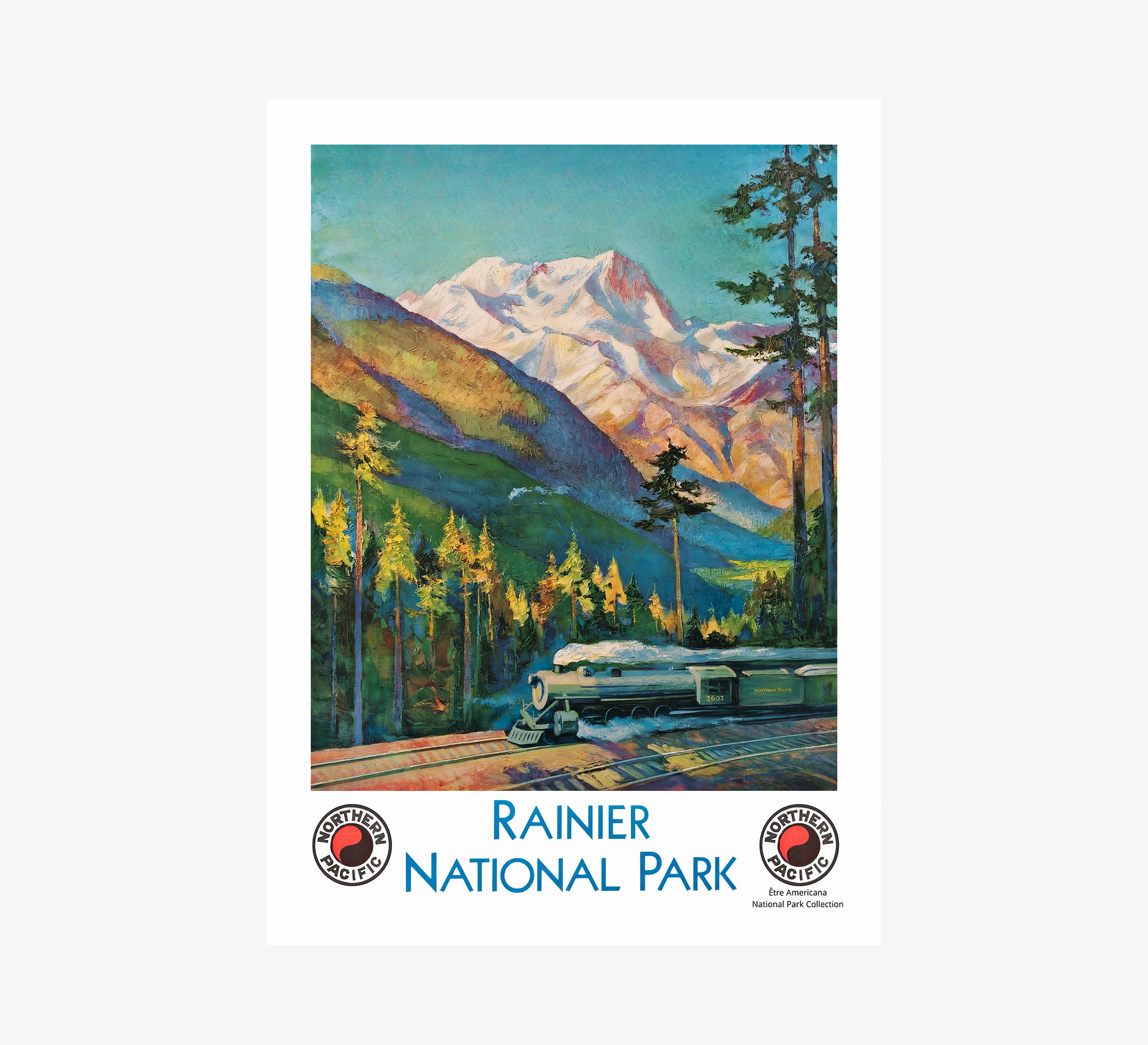 "Rainier National Park" poster featuring a train and mountain scene hanging on a light background