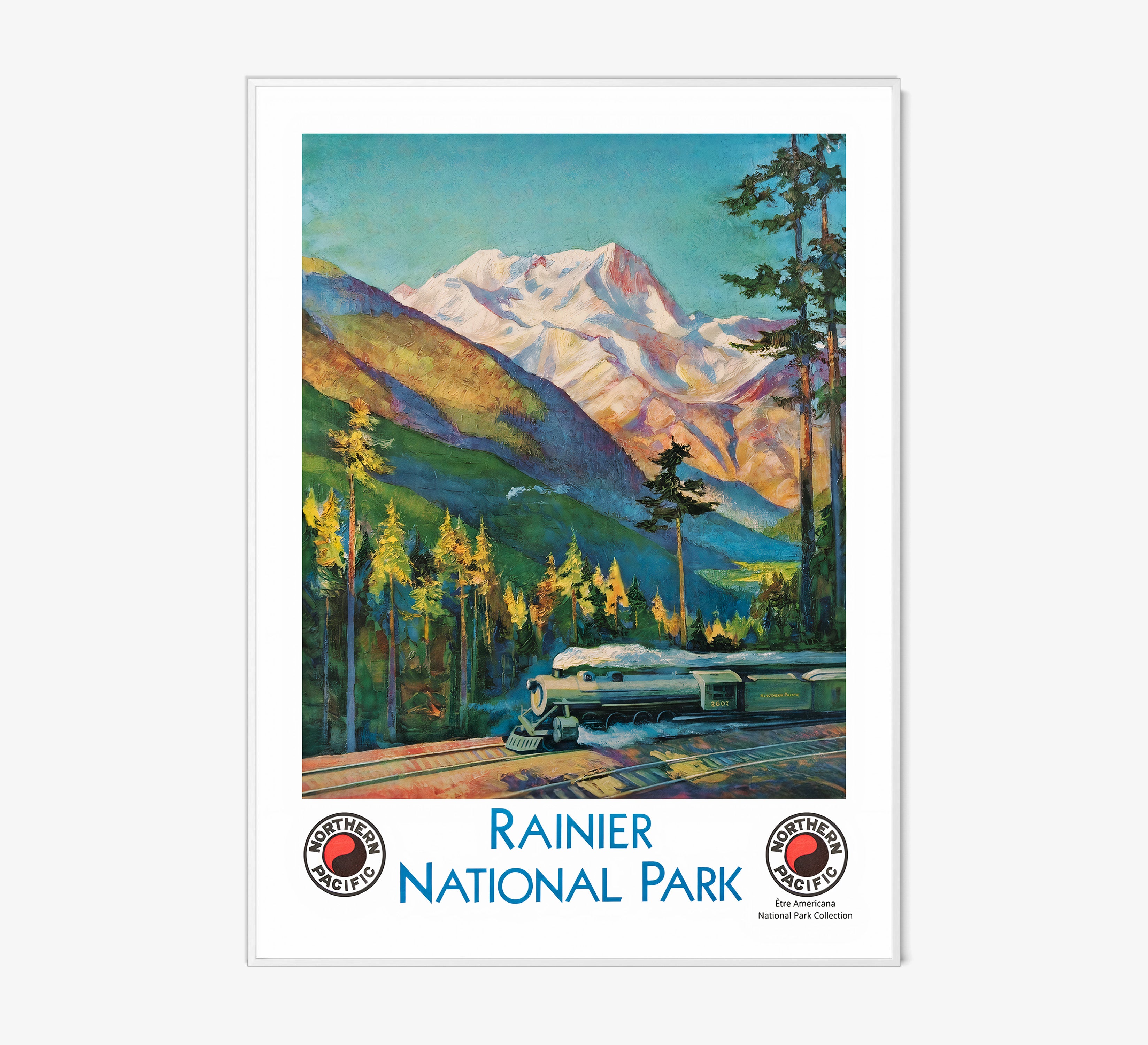 Framed "Rainier National Park" poster featuring a train and mountain scene hanging on a light background