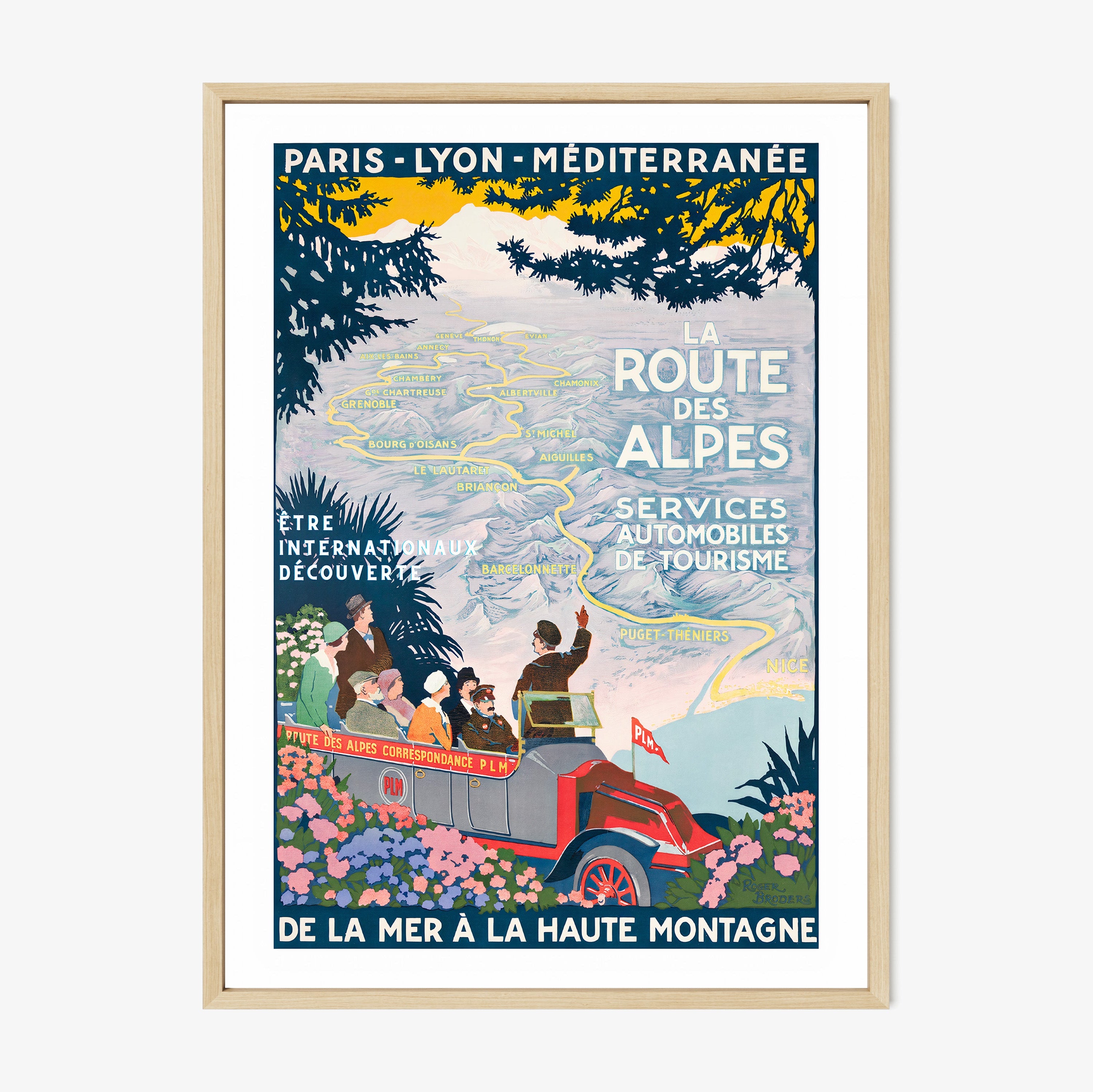 Framed poster featuring a map through the mountains and a tour guide with the text "La Route Des Alpes" at the center hanging on a light background