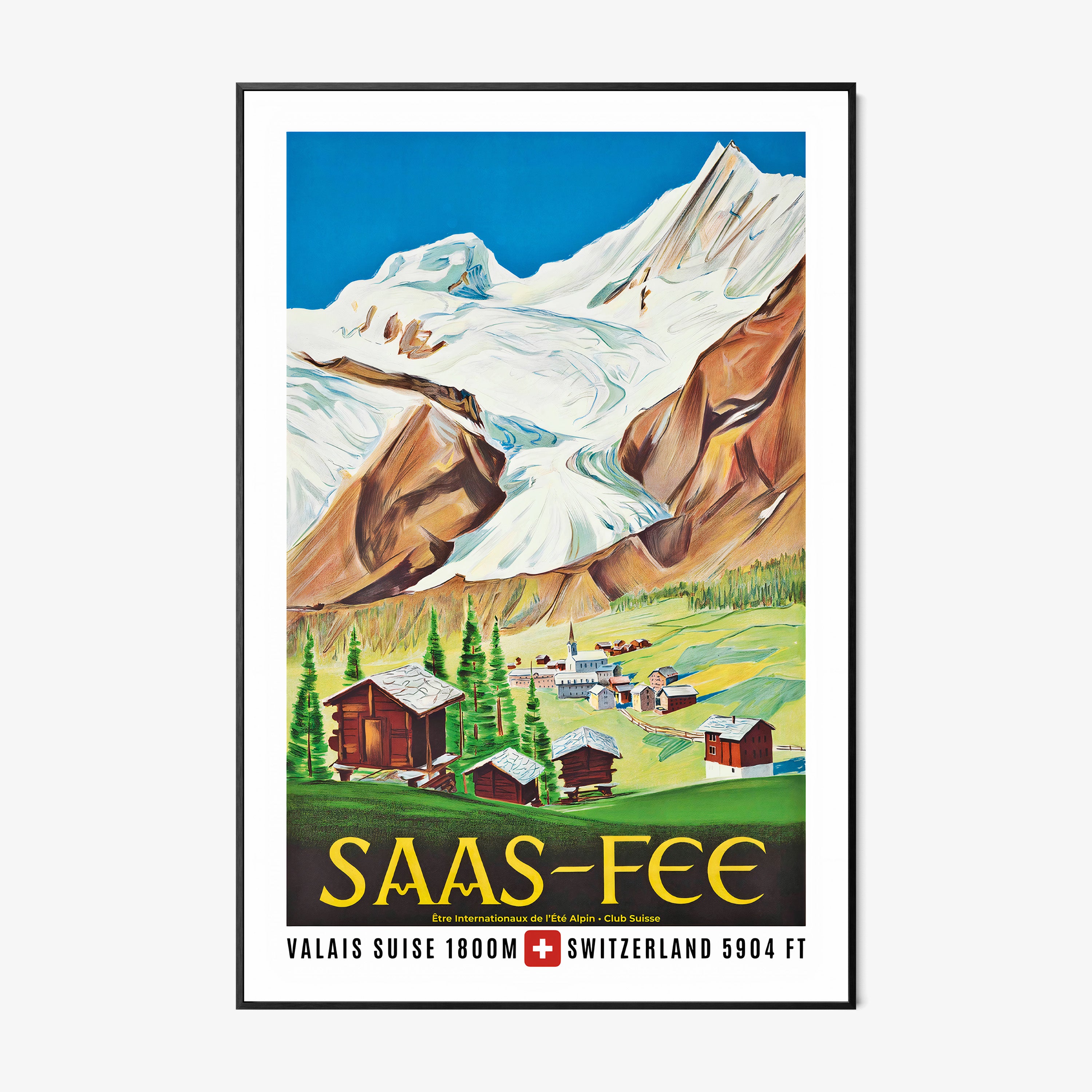 Framed poster of a large mountain with a small town shown at the base of it with the text "Saas-Fee" at the bottom hanging on a white background
