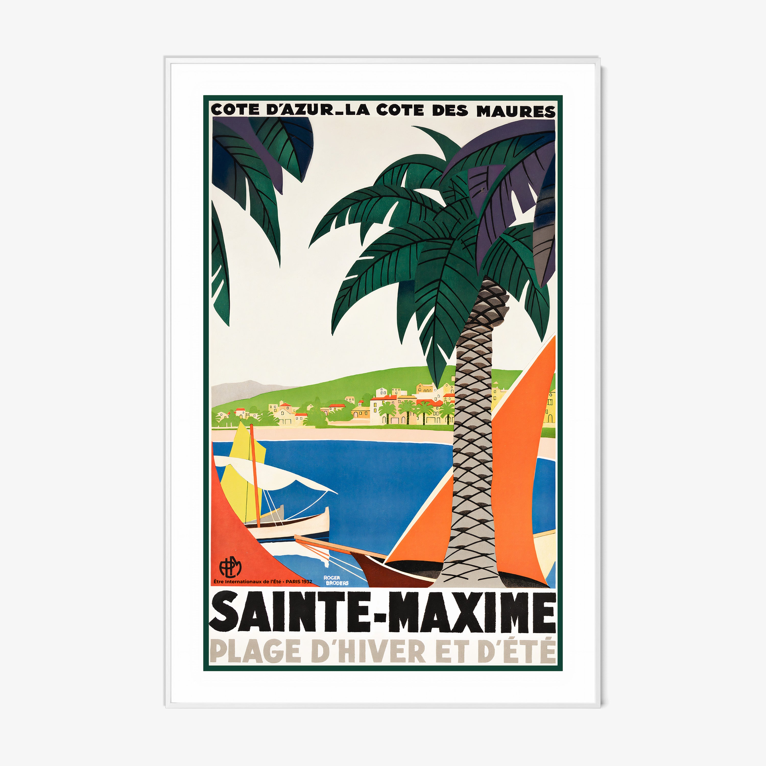 Framed poster featuring sailboats on a blue sea surrounded by palm trees and a coastal village with the text "Sainte-Maxime" at the bottom hanging on a white background