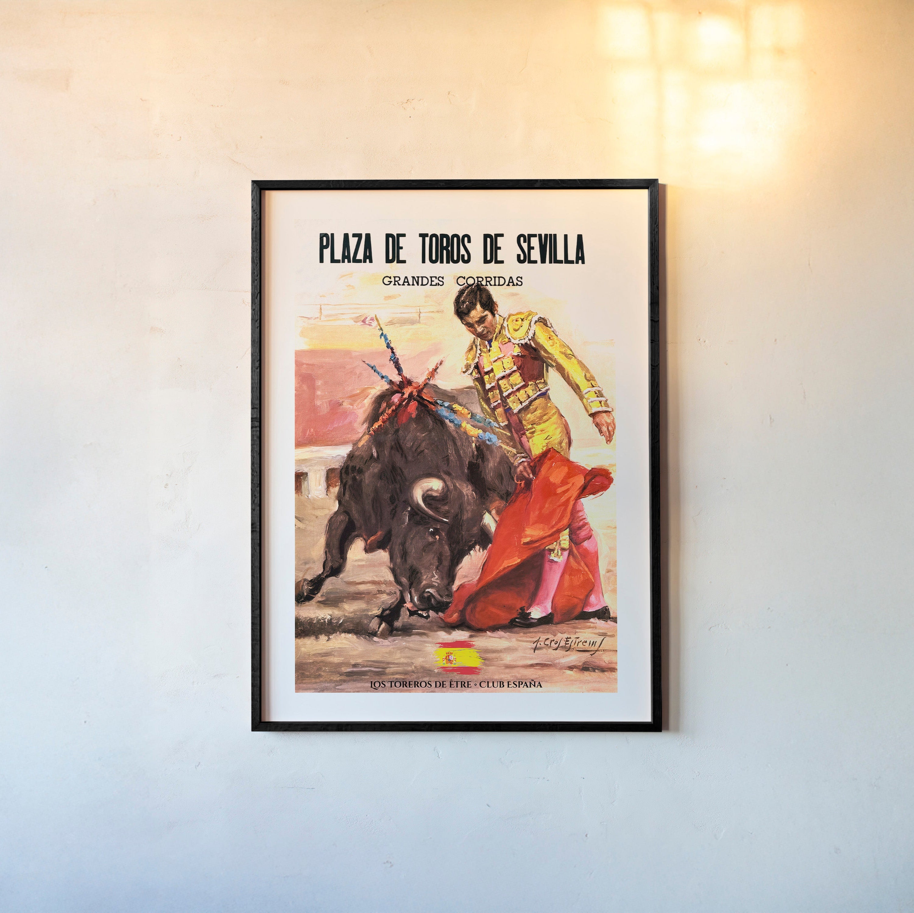 Framed poster of a bullfighter hanging on a light background