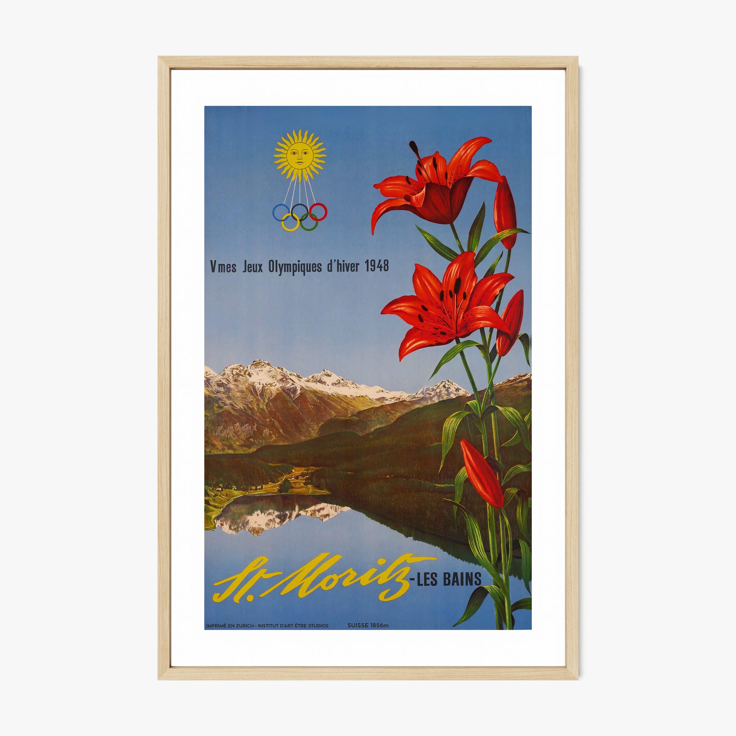 Framed poster with red flowers and mountain landscape on a wall.