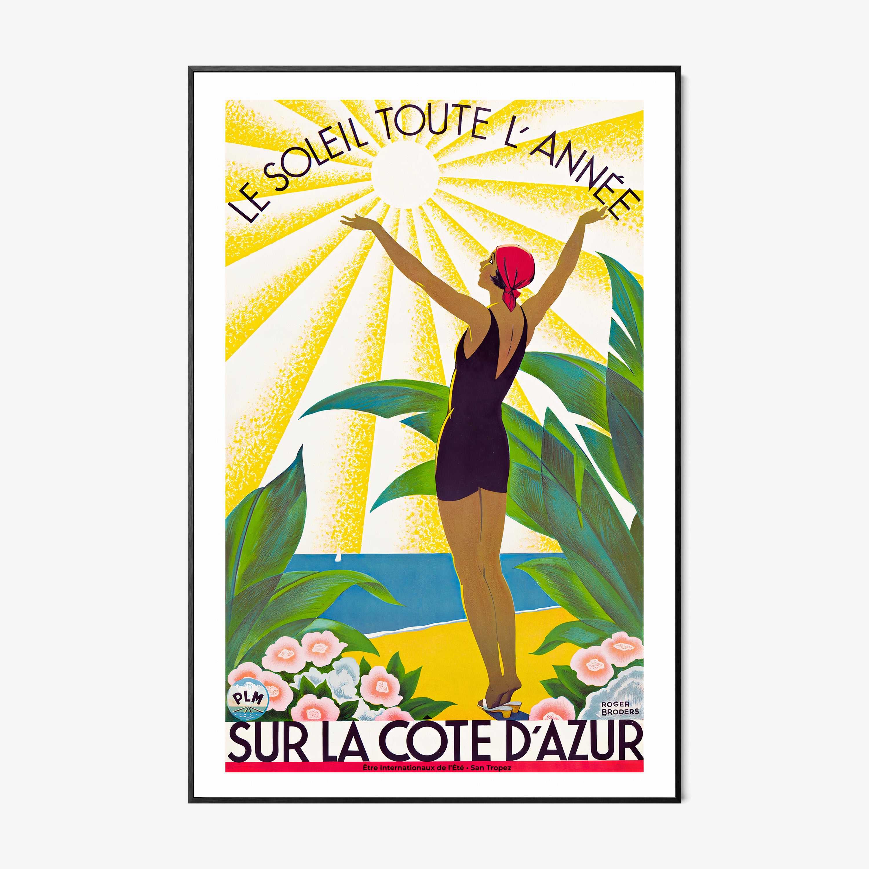 Framed poster of a woman standing with her arms raised to the sun and the text "Sur La Cote D'Azur" at the bottom hanging on a light background