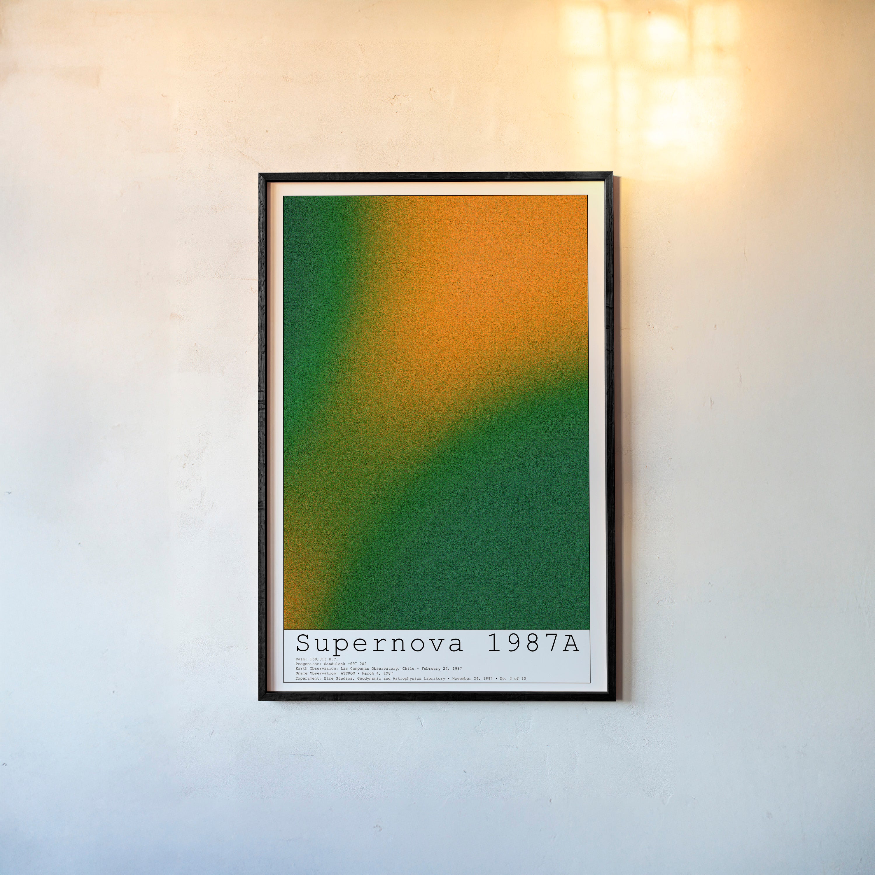 Framed poster of "Supernova" featuring a combination of orange and green colors hanging on a light background