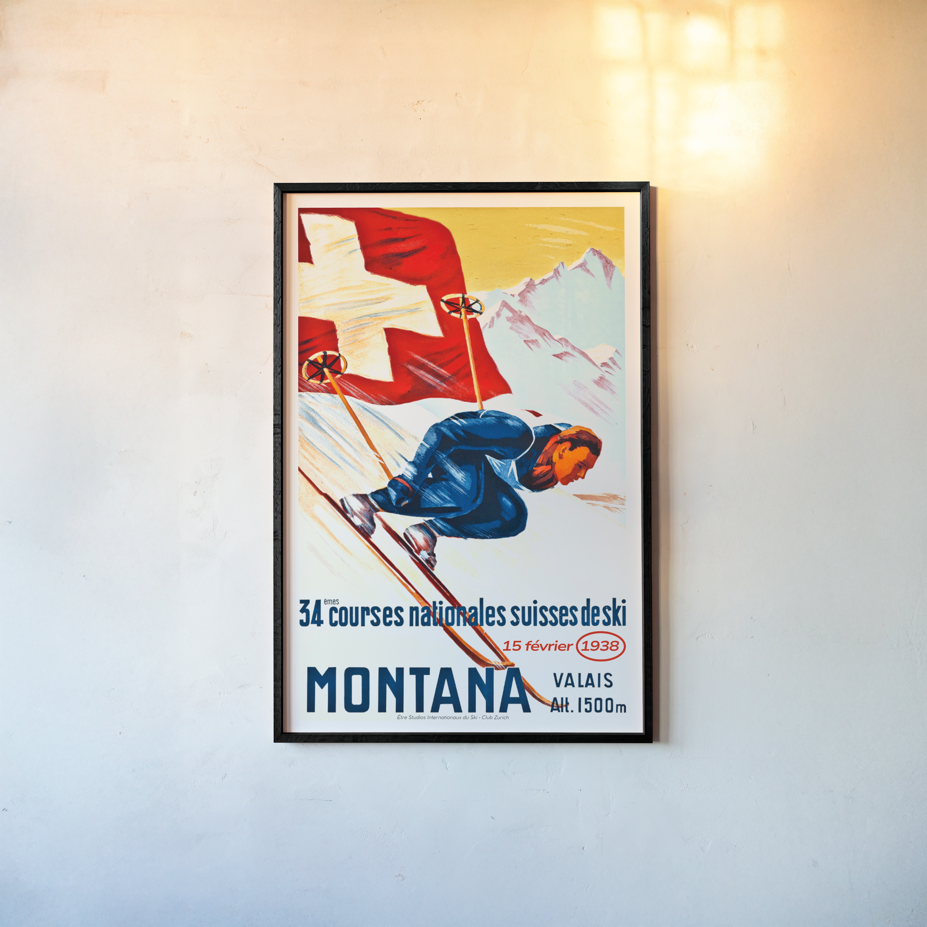 Framed vintage-style poster of a skier with a Swiss flag against a mountain backdrop on a wall.