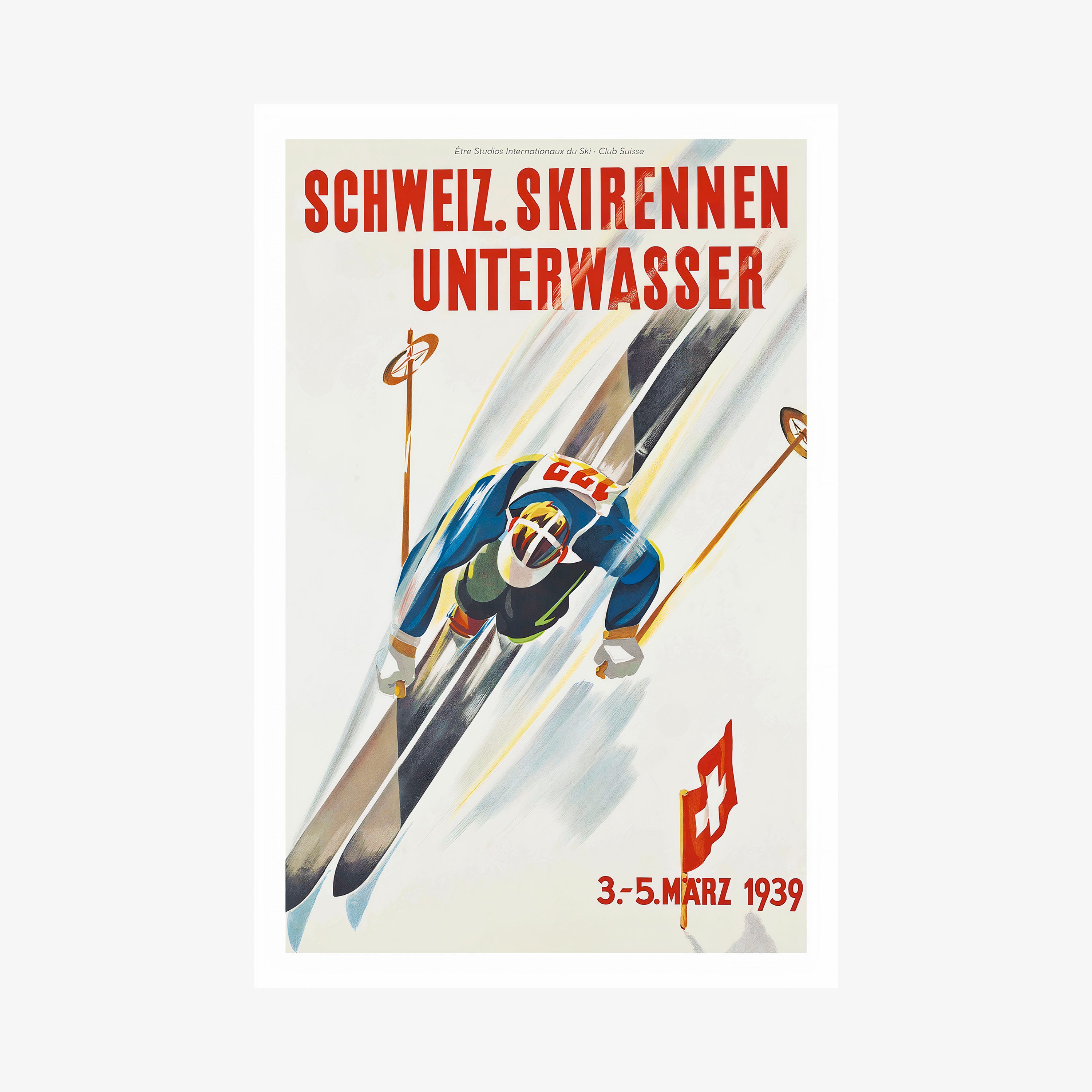 Poster of a skier taken from above hanging on a light backdrop