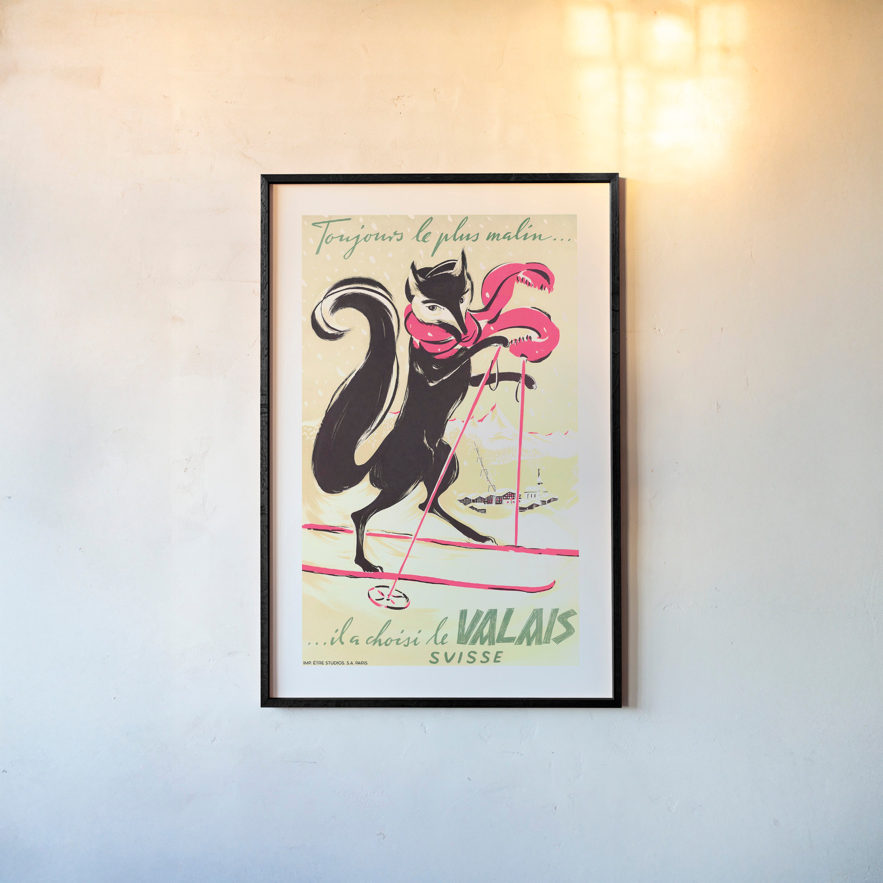 Framed poster of a fox on a pair of skis hanging on a light background