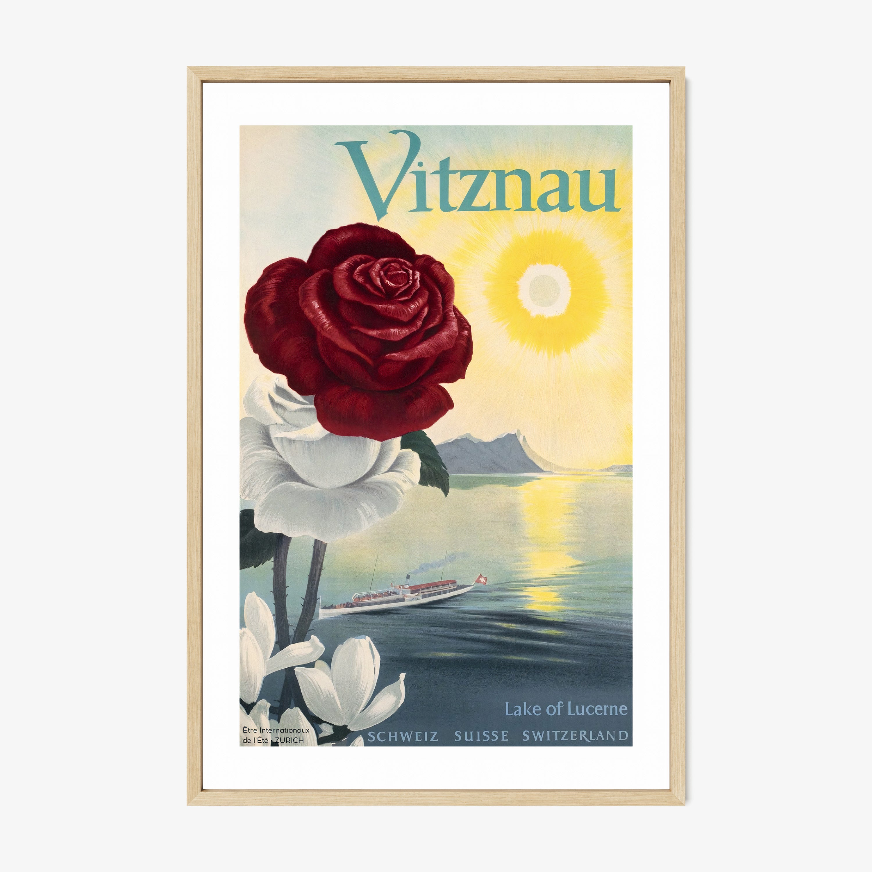 Framed poster of a large rose and an ocean background with the text "Vitznau" at the top hanging on a wall with a light background