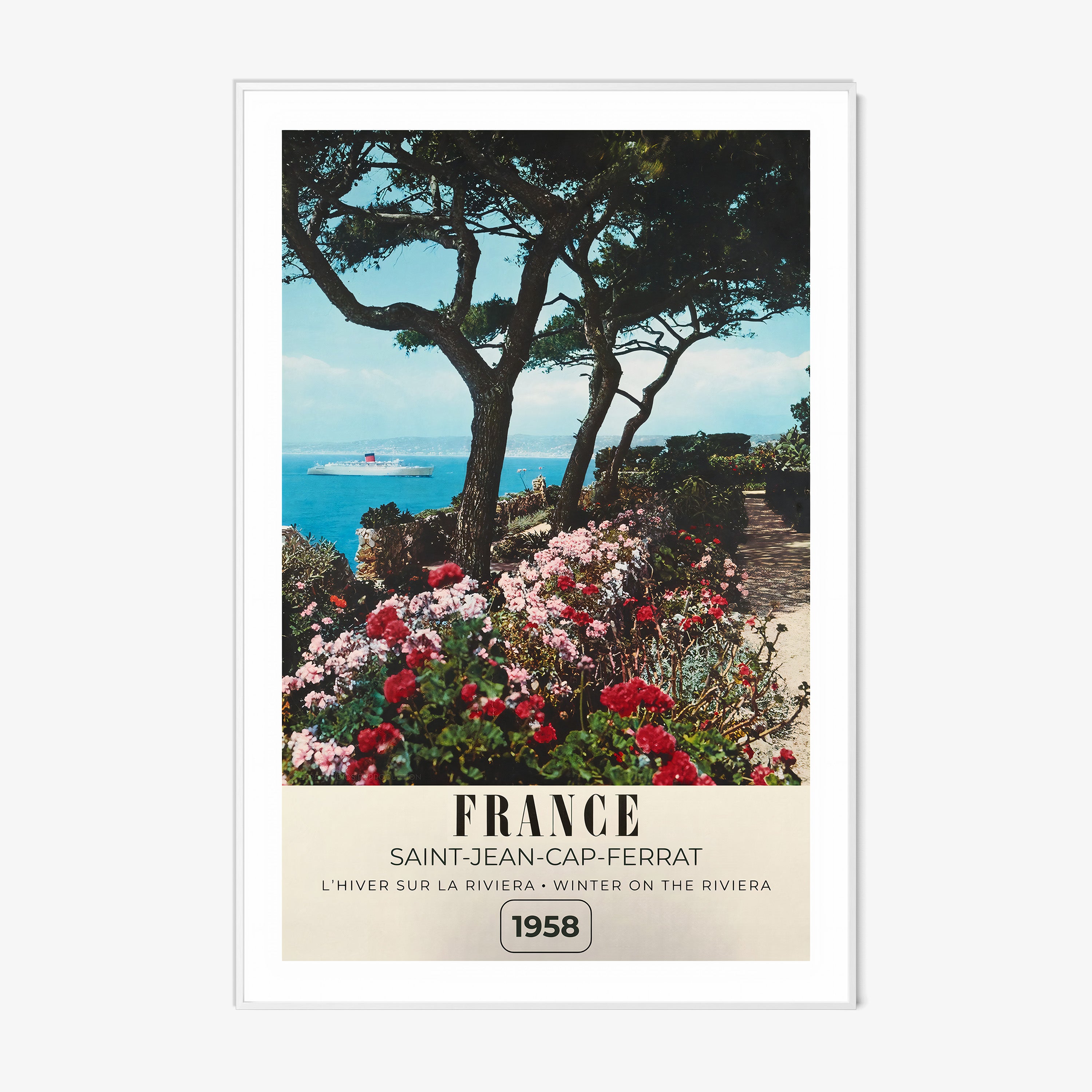 Framed poster of a river with flowers blooming around it and the text "France" in large letters, hanging on a wall with a light background