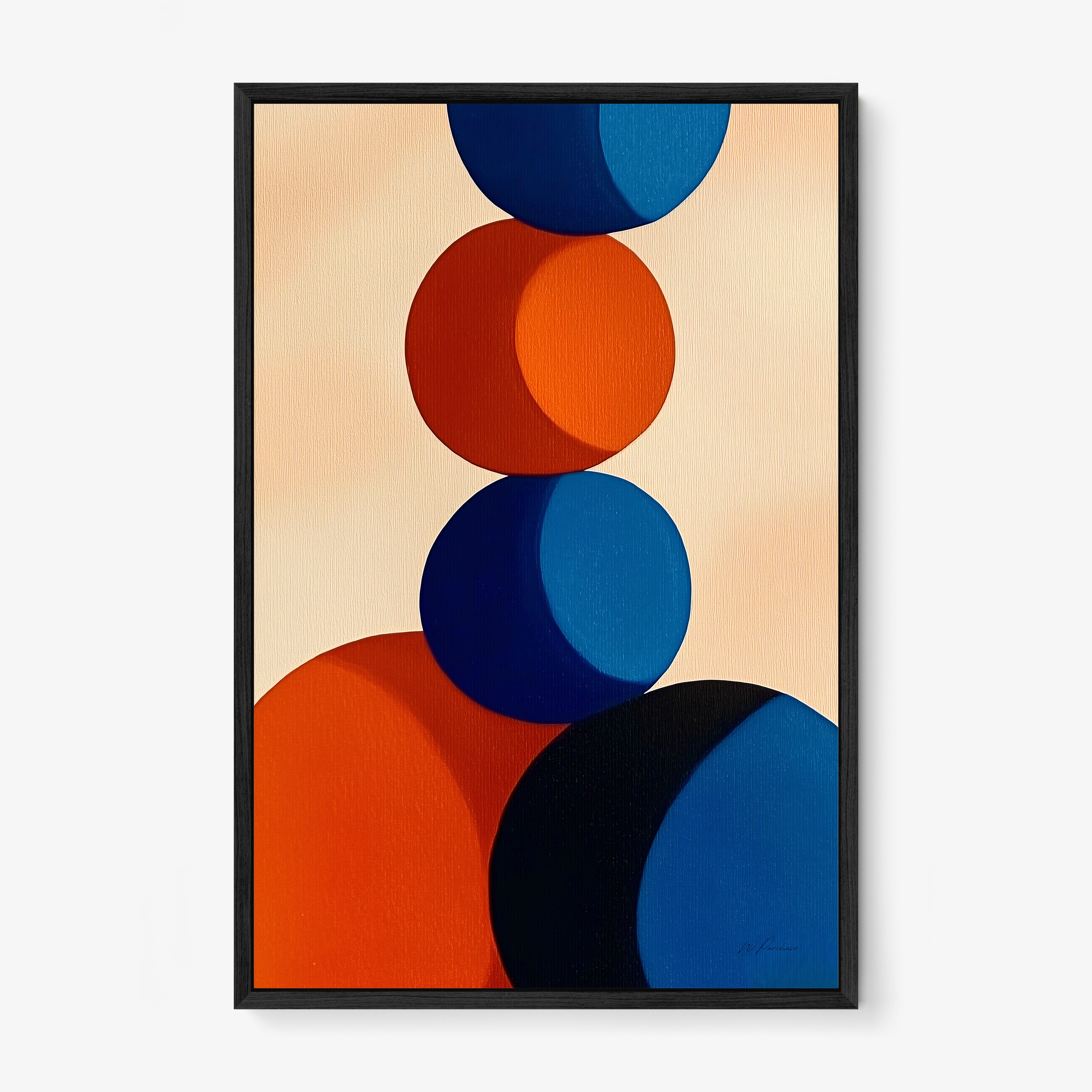 Framed poster of red and blue circle stacked on each other hanging on a light background