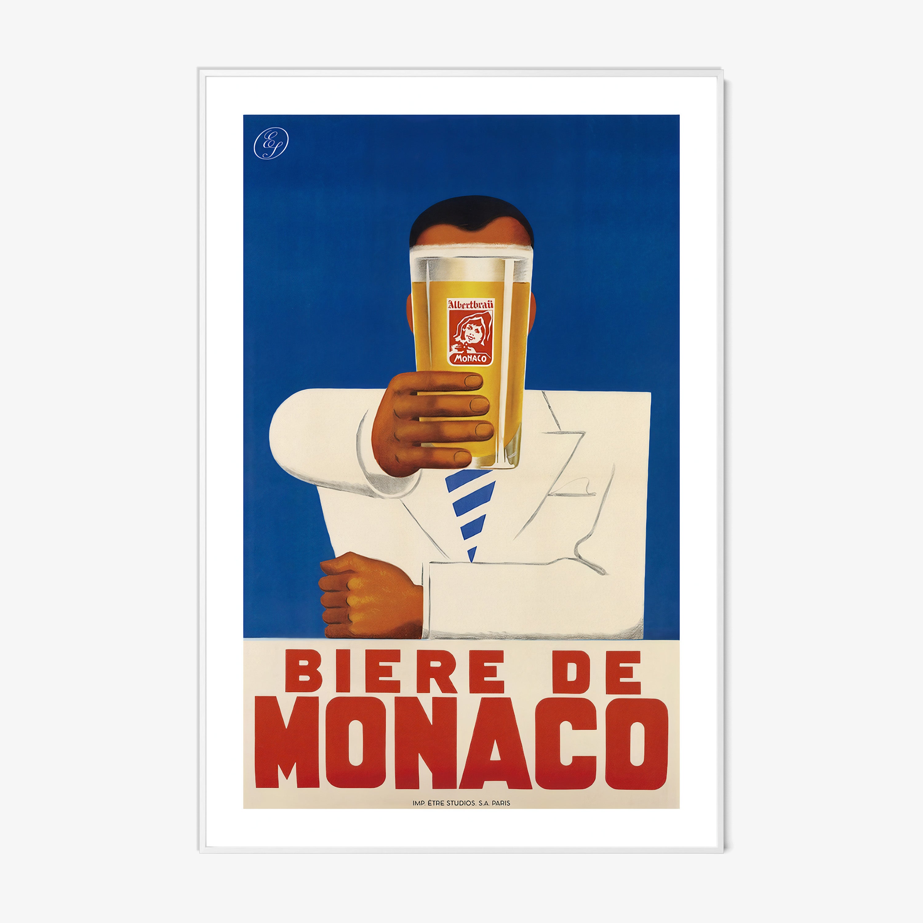 A framed poster features a person holding a beer with bold text "Biere De Monaco"