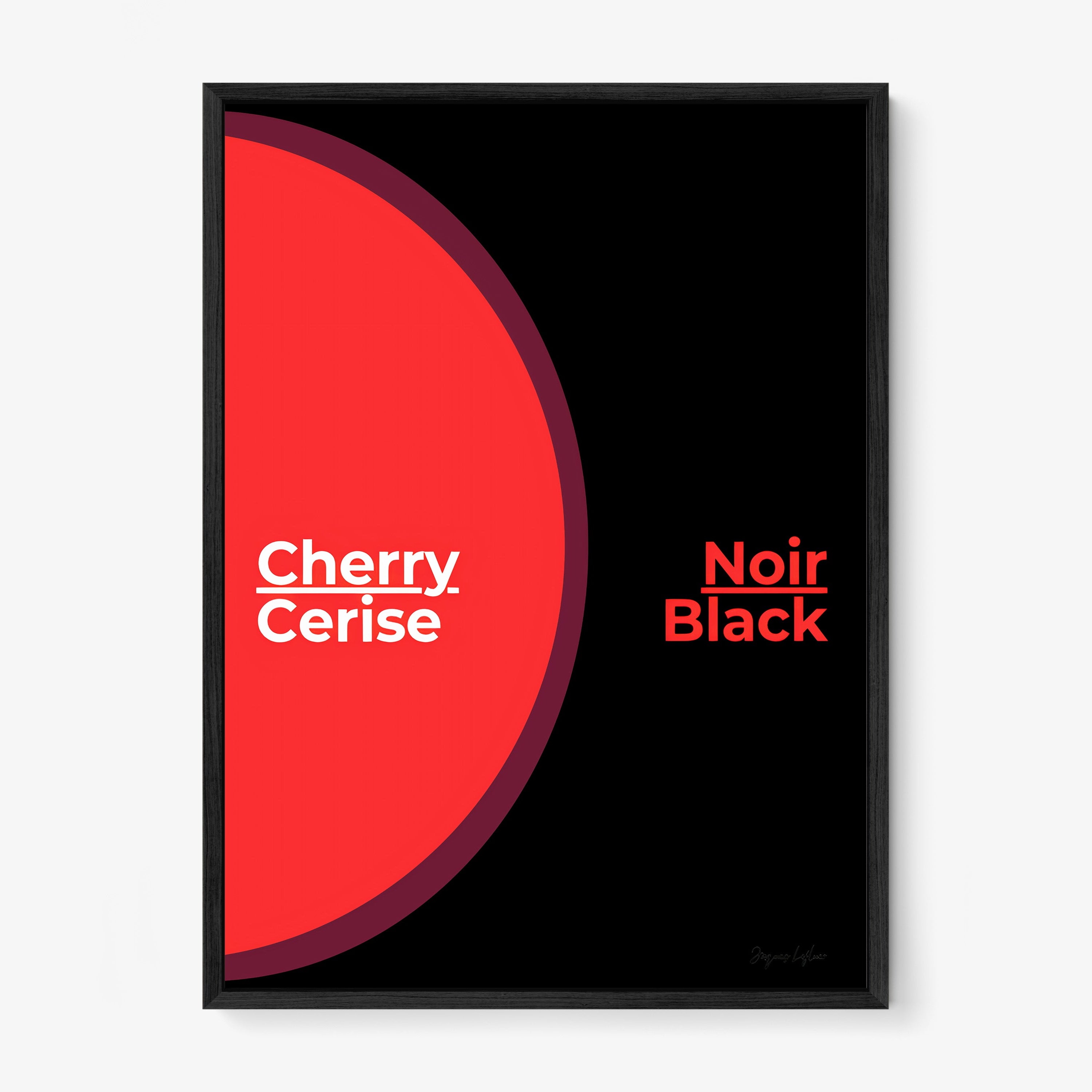 Framed poster of the words "Cherry Black" in English and French hanging on a light background