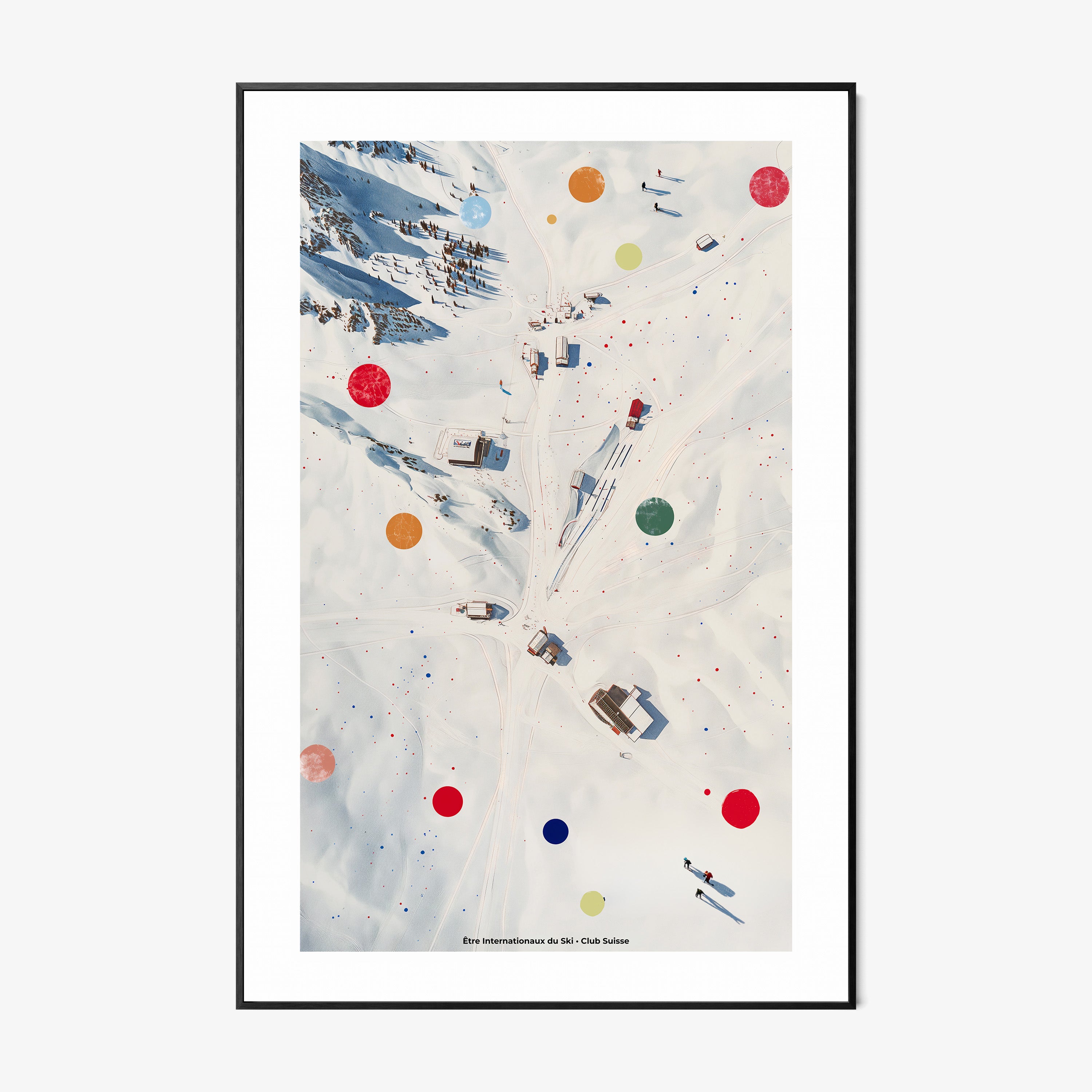 Framed poster of an overhead view of a snowy covered ski area hanging on a light background