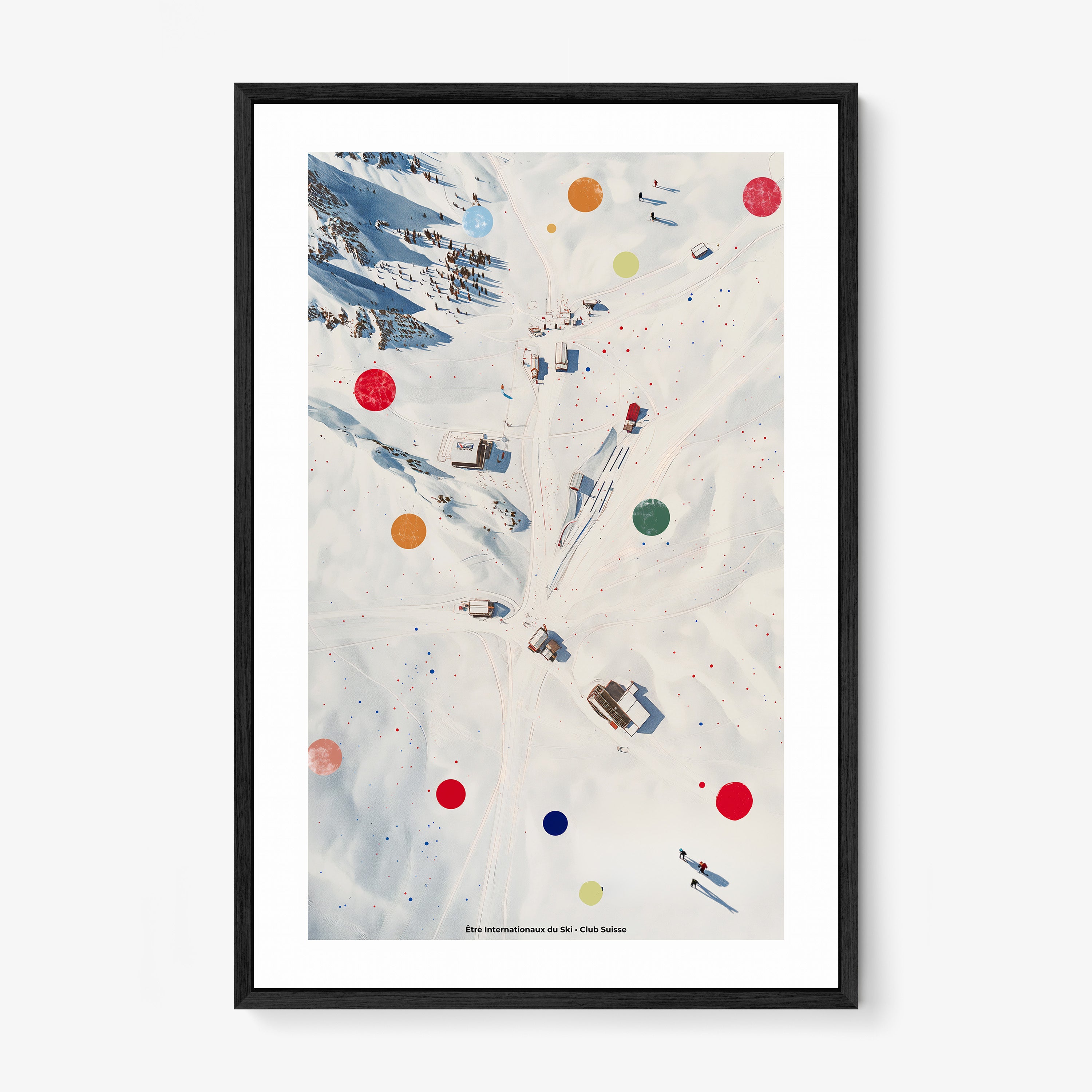 Framed poster of an overhead view of a snowy covered ski area hanging on a light background