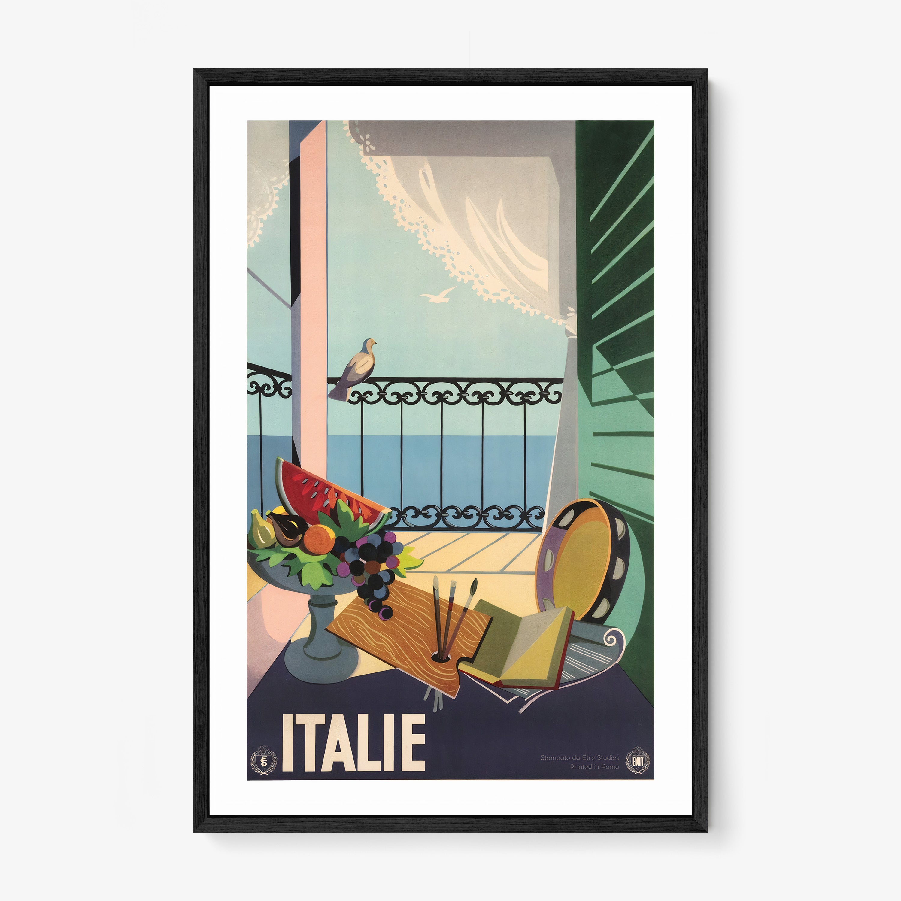 Framed poster of porch scene surrounded by artistic materials with the text "Italie" at the bottom hanging on a light background
