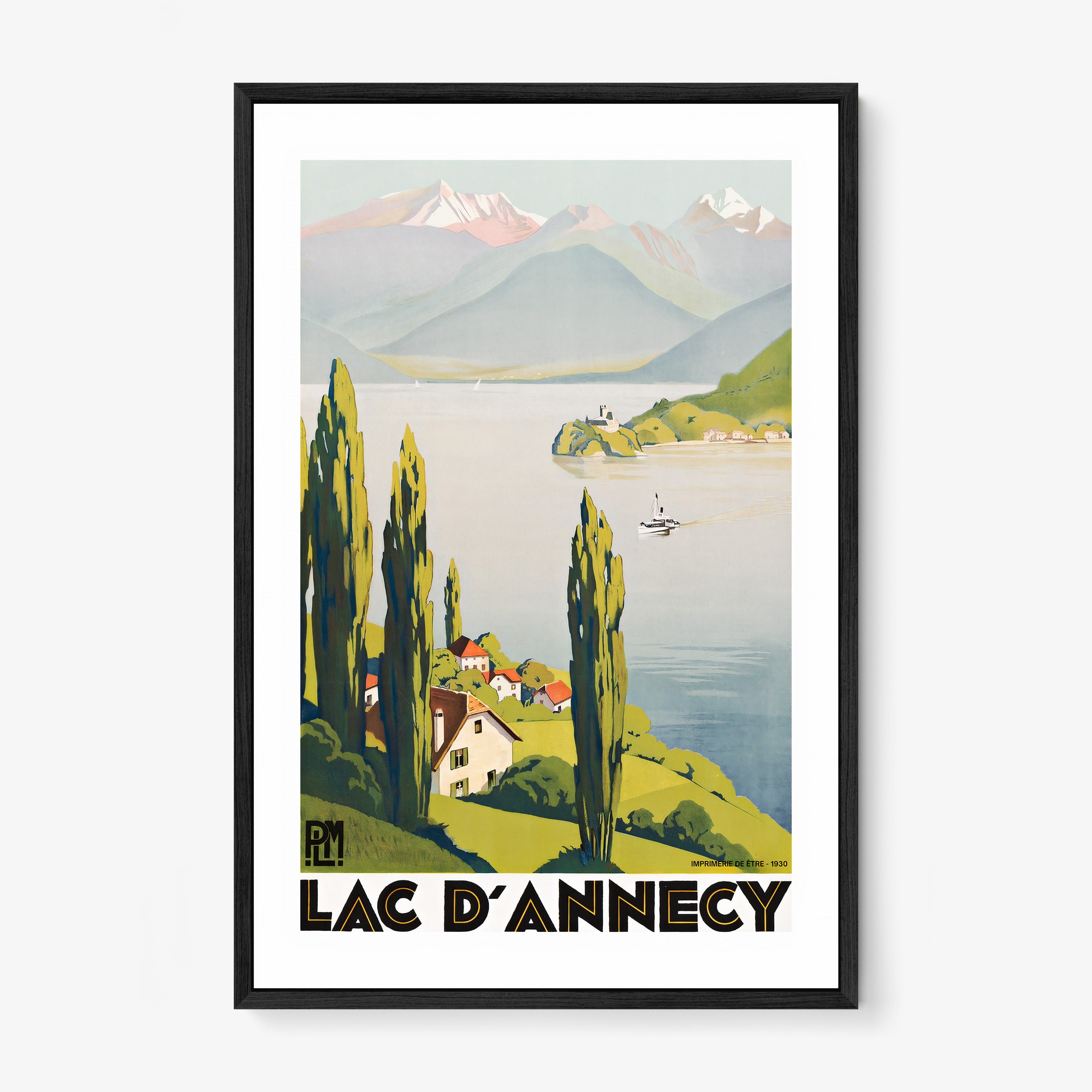 Framed "Lac D'Annecy" poster featuring a lake with a scenic mountain background hanging on a light background