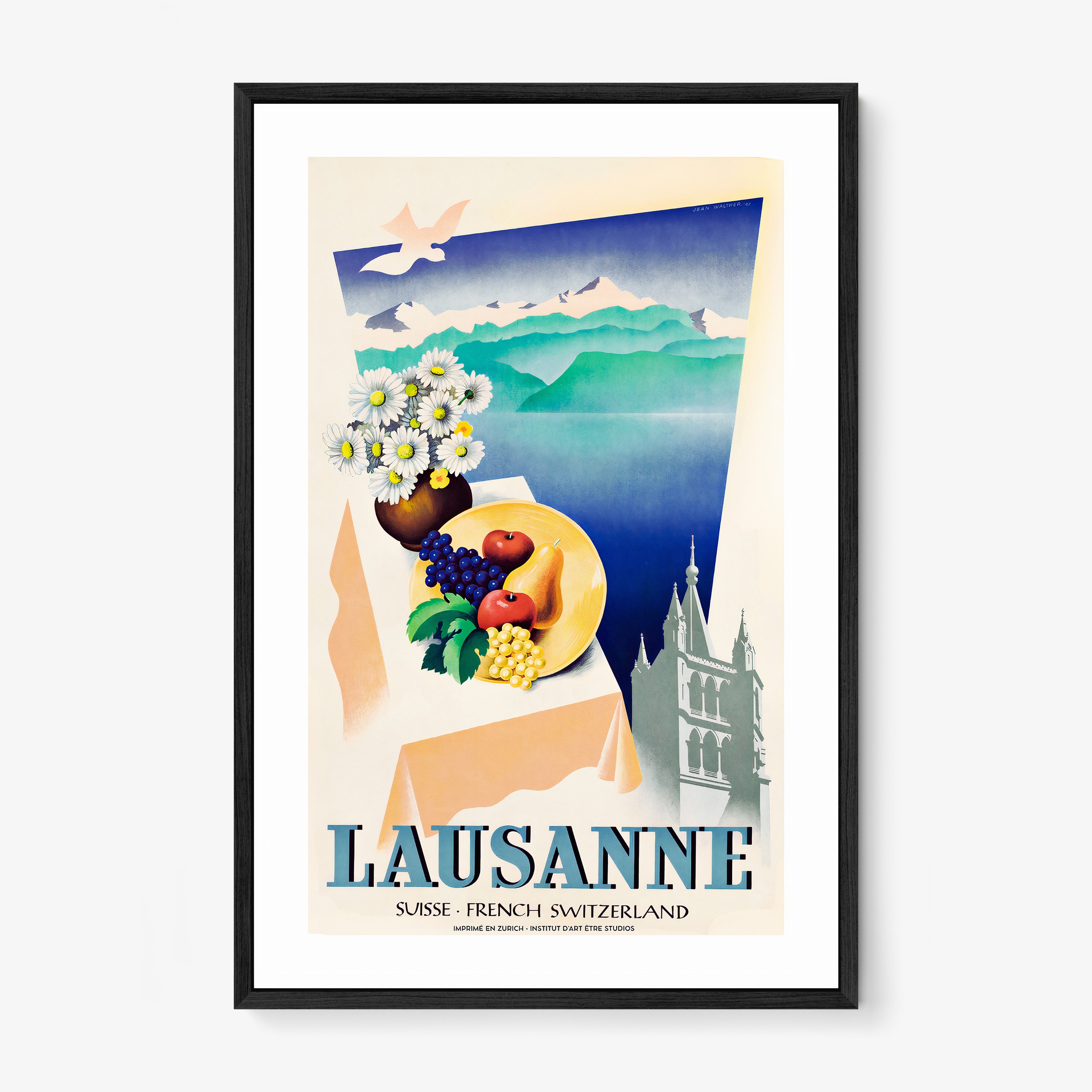 Framed poster of different elements with a mountain lake background and the text "Lausanne" at the bottom hanging on a light background