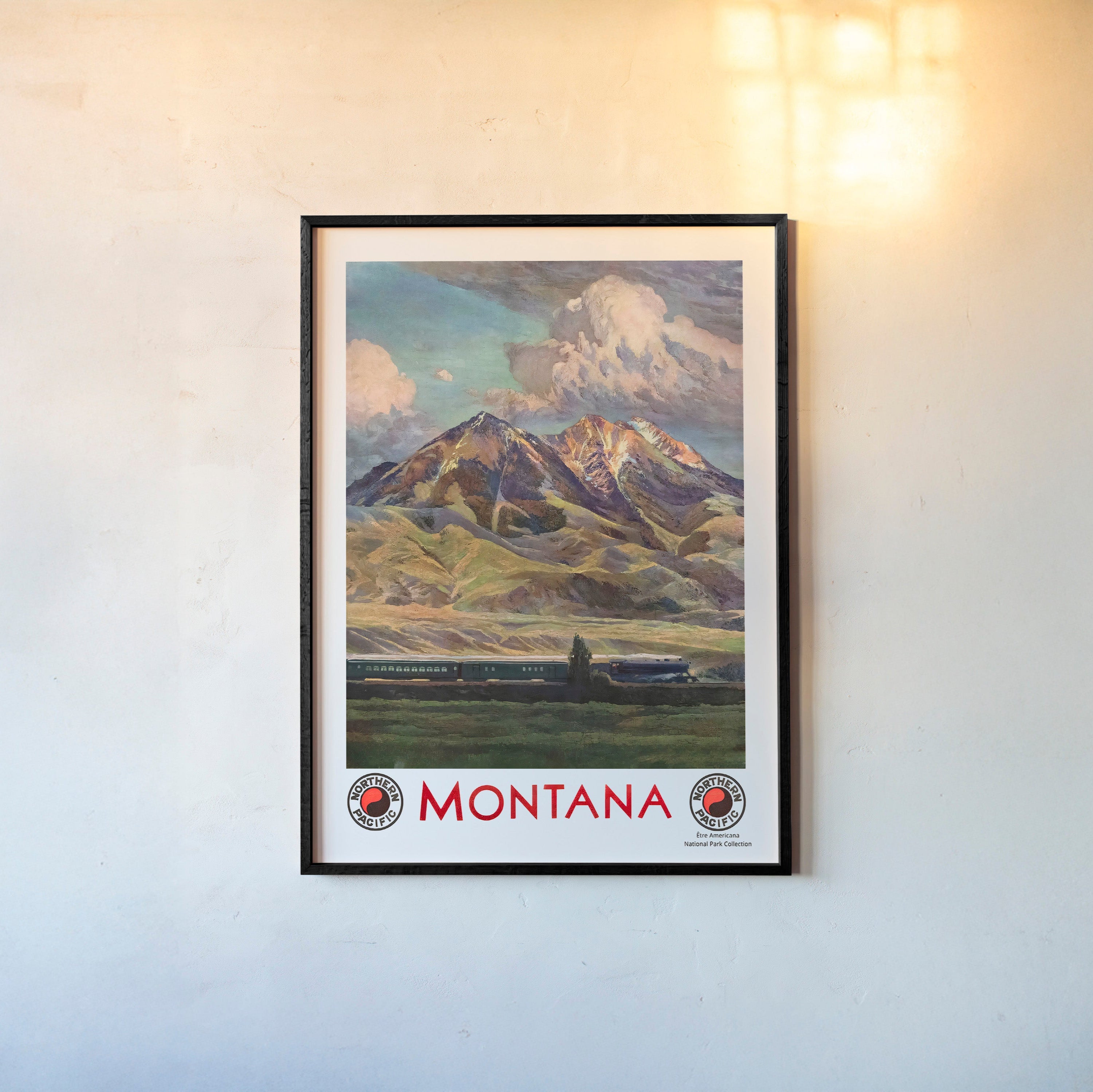 Framed poster of a mountain scene in Montana hanging on a light background