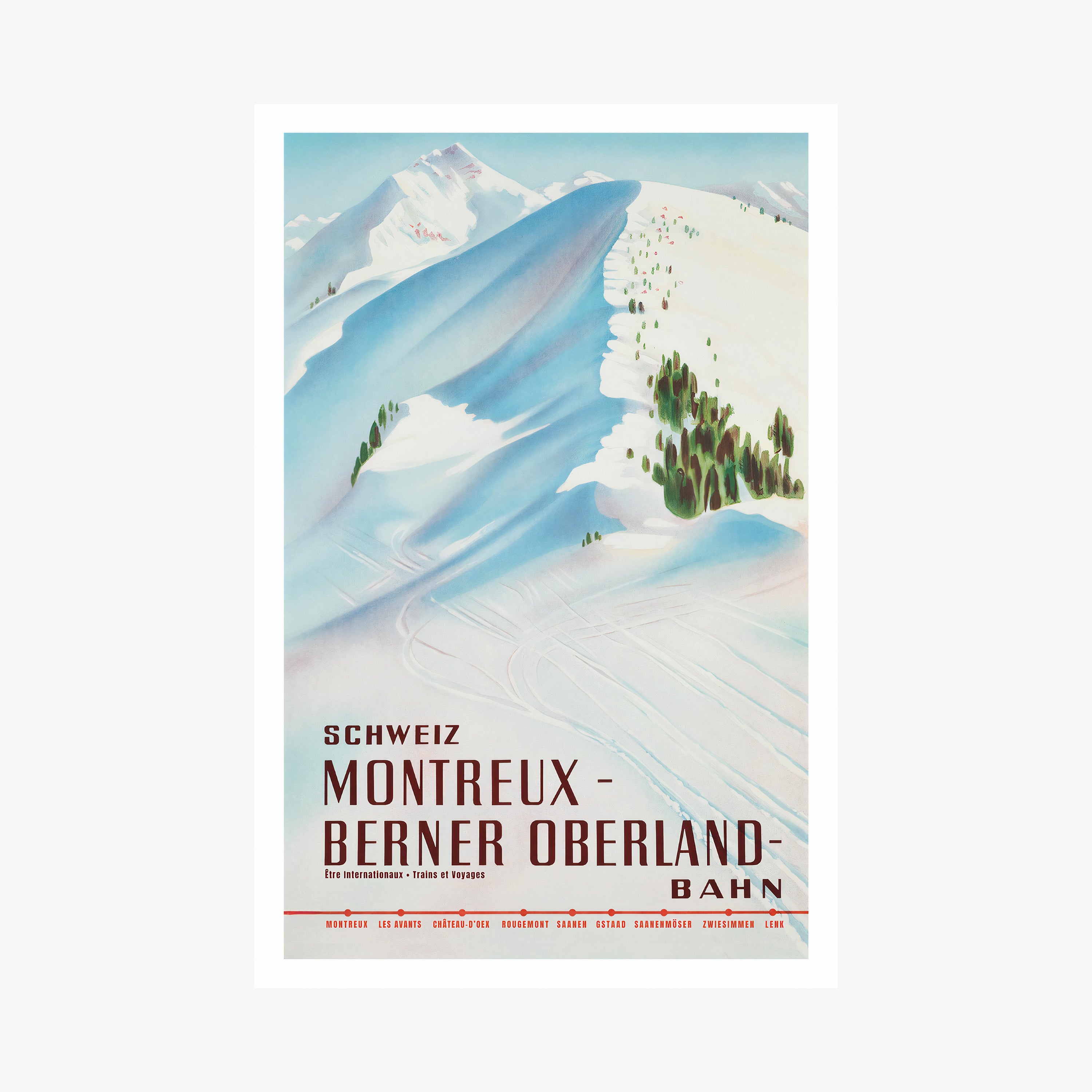 Framed poster featuring a snow covered mountain with the text "Montreux- Berner Oberland" at the bottom hanging on a white background