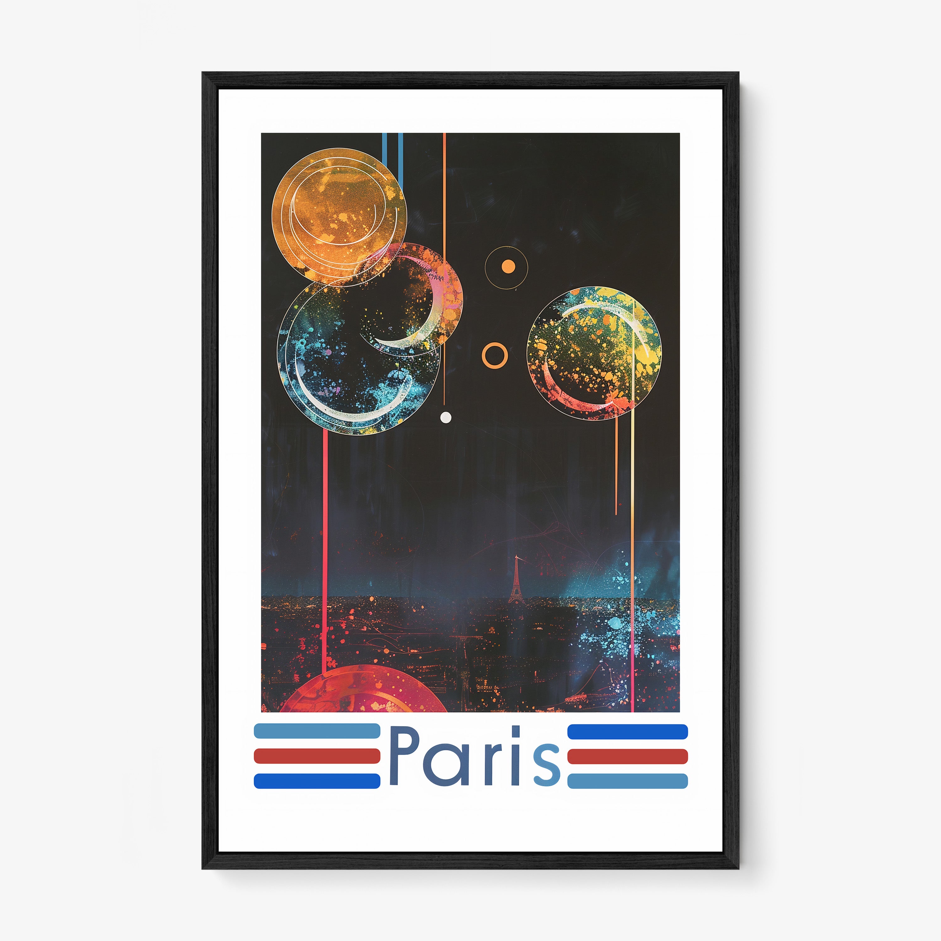Framed poster of a colorful nighttime scene over Paris on a wall with a light background