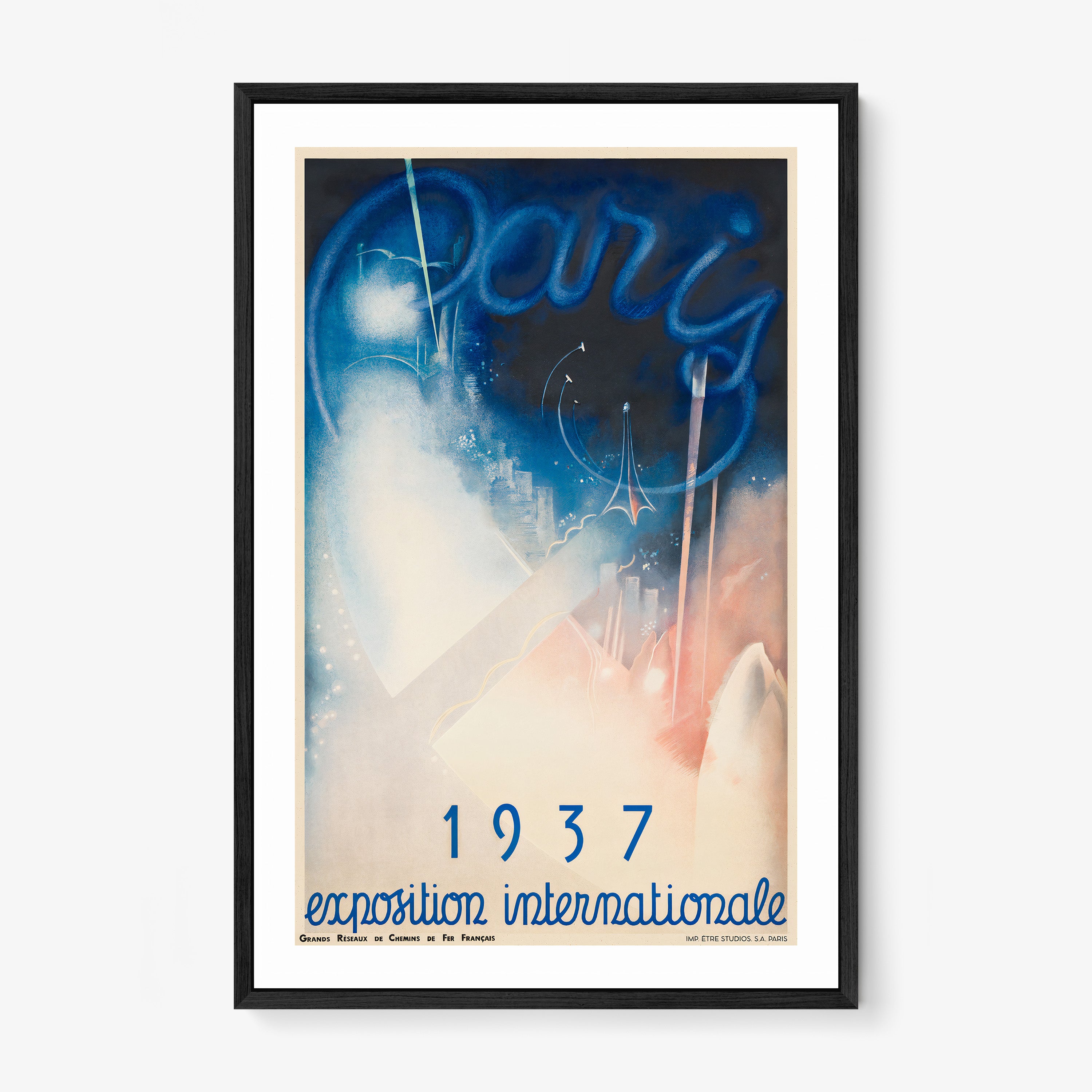 Framed poster of a whimsical blue and pink Paris scene with the text "1937 exposition internationale" at the bottom hanging on a light background