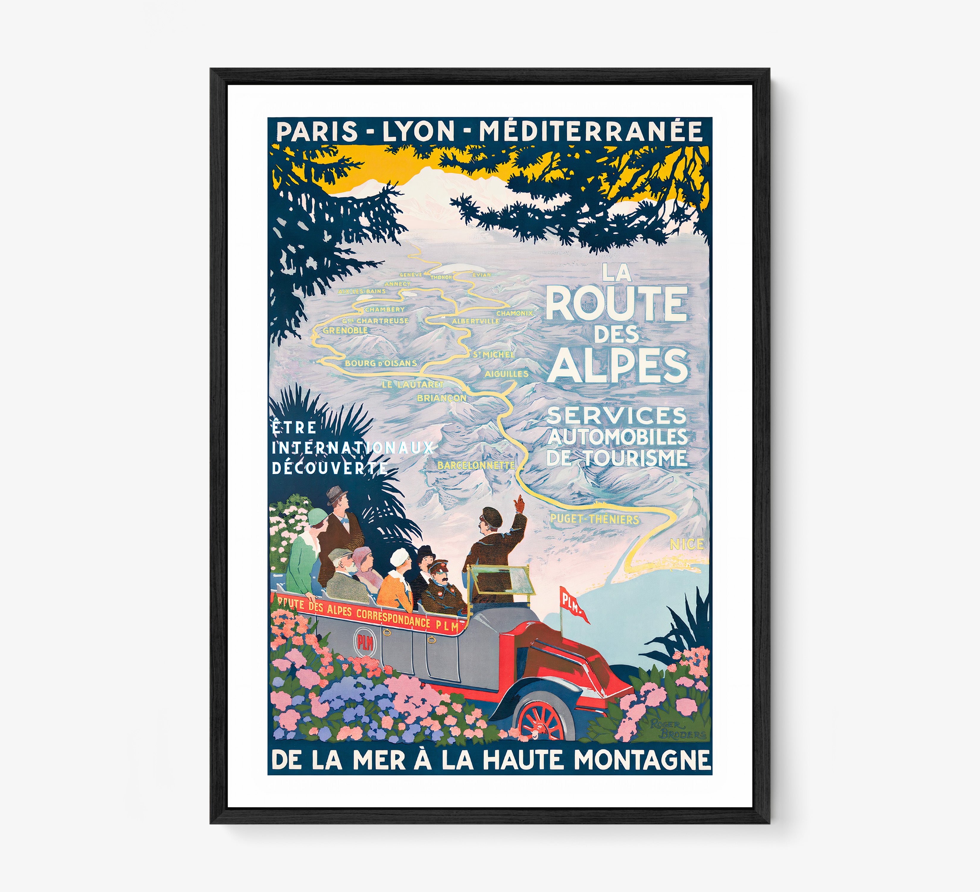 Framed poster featuring a map through the mountains and a tour guide with the text "La Route Des Alpes" at the center hanging on a light background