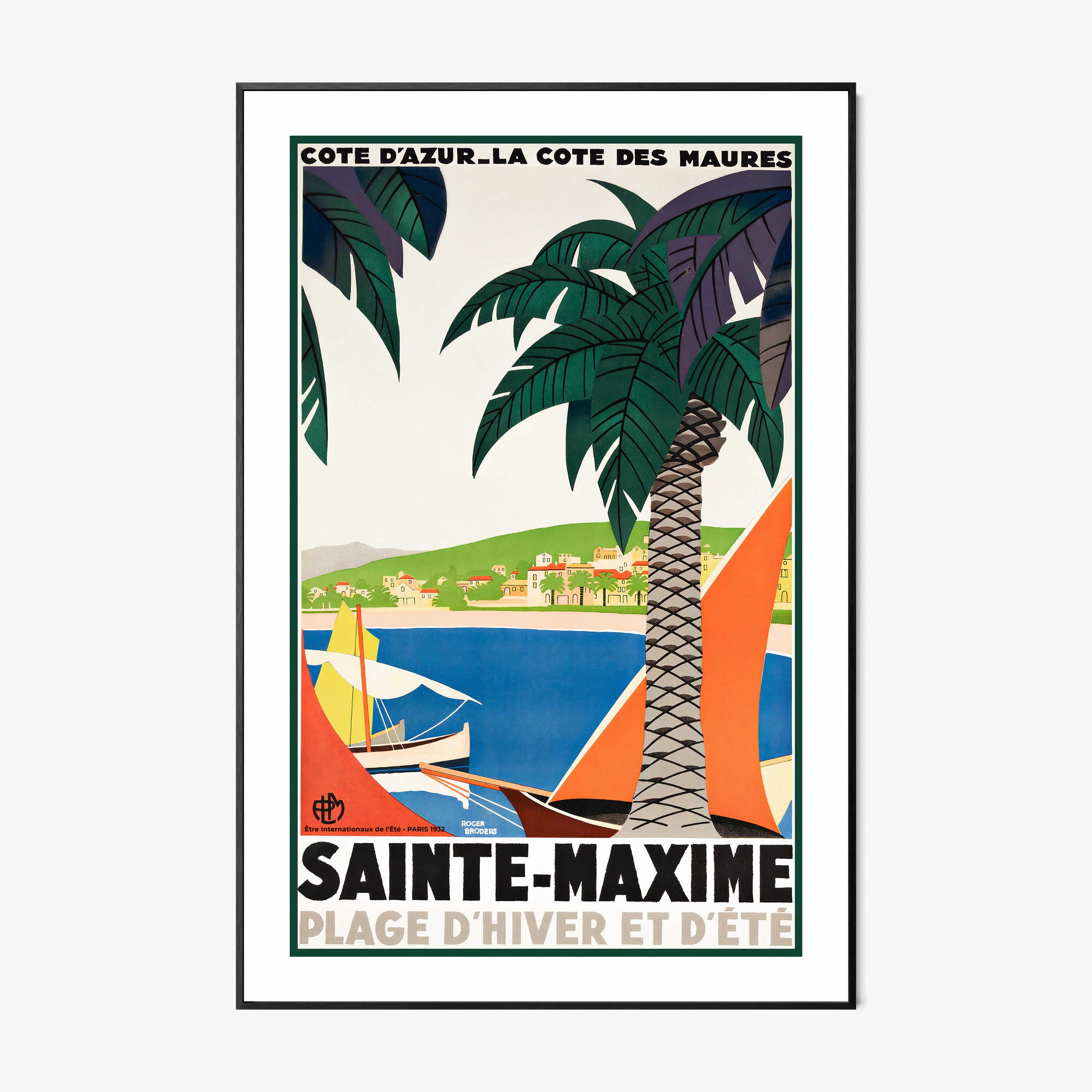 Framed poster featuring sailboats on a blue sea surrounded by palm trees and a coastal village with the text "Sainte-Maxime" at the bottom hanging on a white background