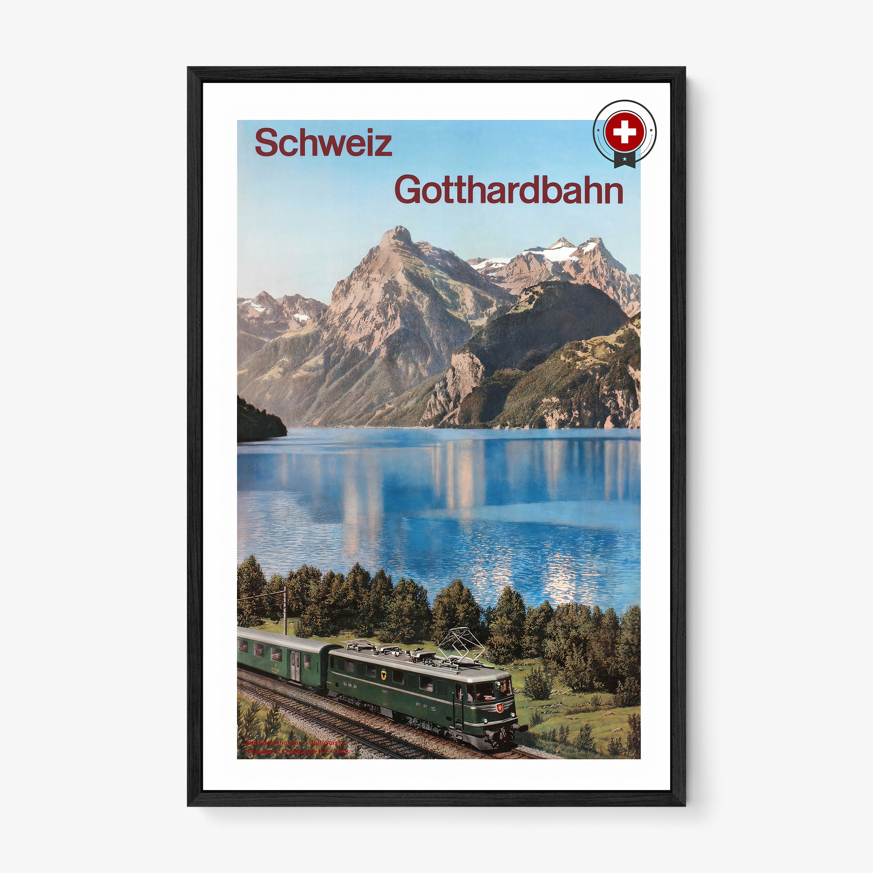 Framed poster of "Schweiz Gotthardbahn" featuring a train next to a mountain lake scene