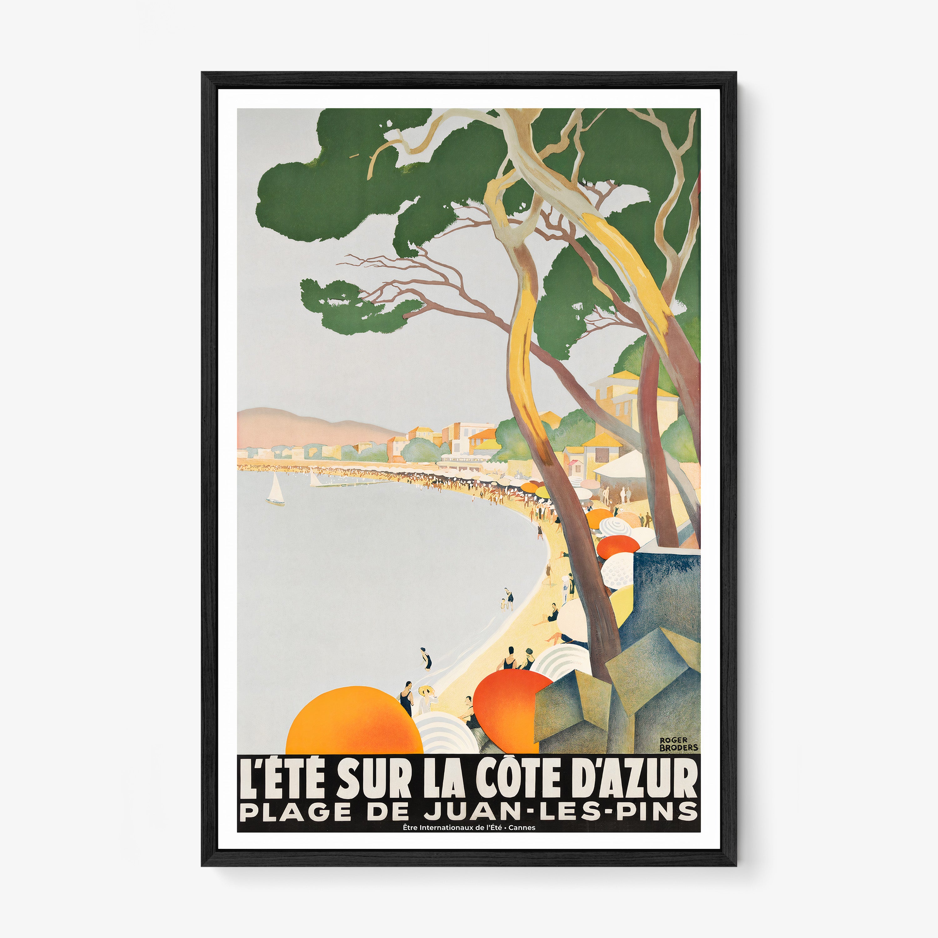 Framed poster of a coastal beach area hanging on a light background