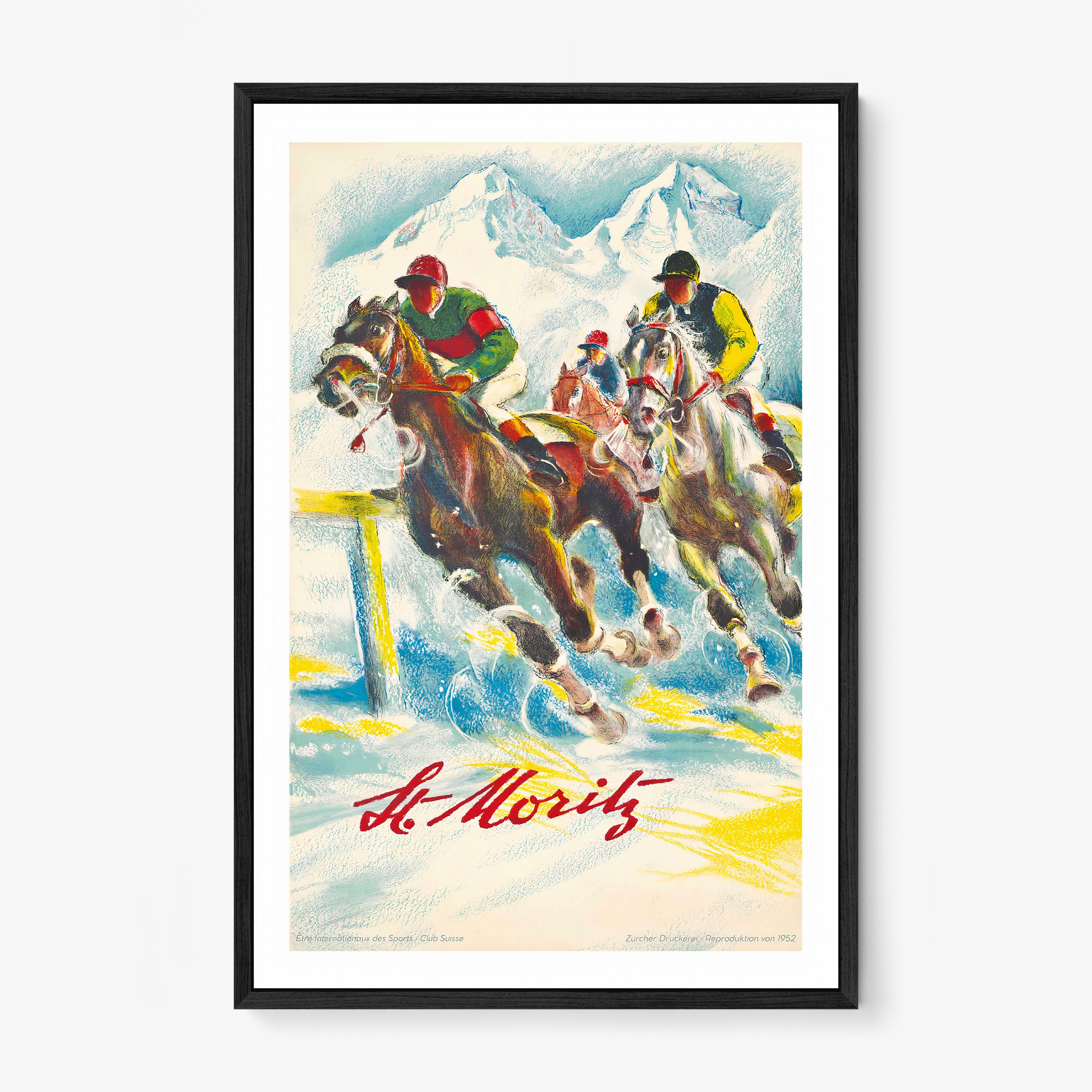 Framed poster of horse racers in the mountains with the text "St.Moritz" at the bottom hanging on a light background
