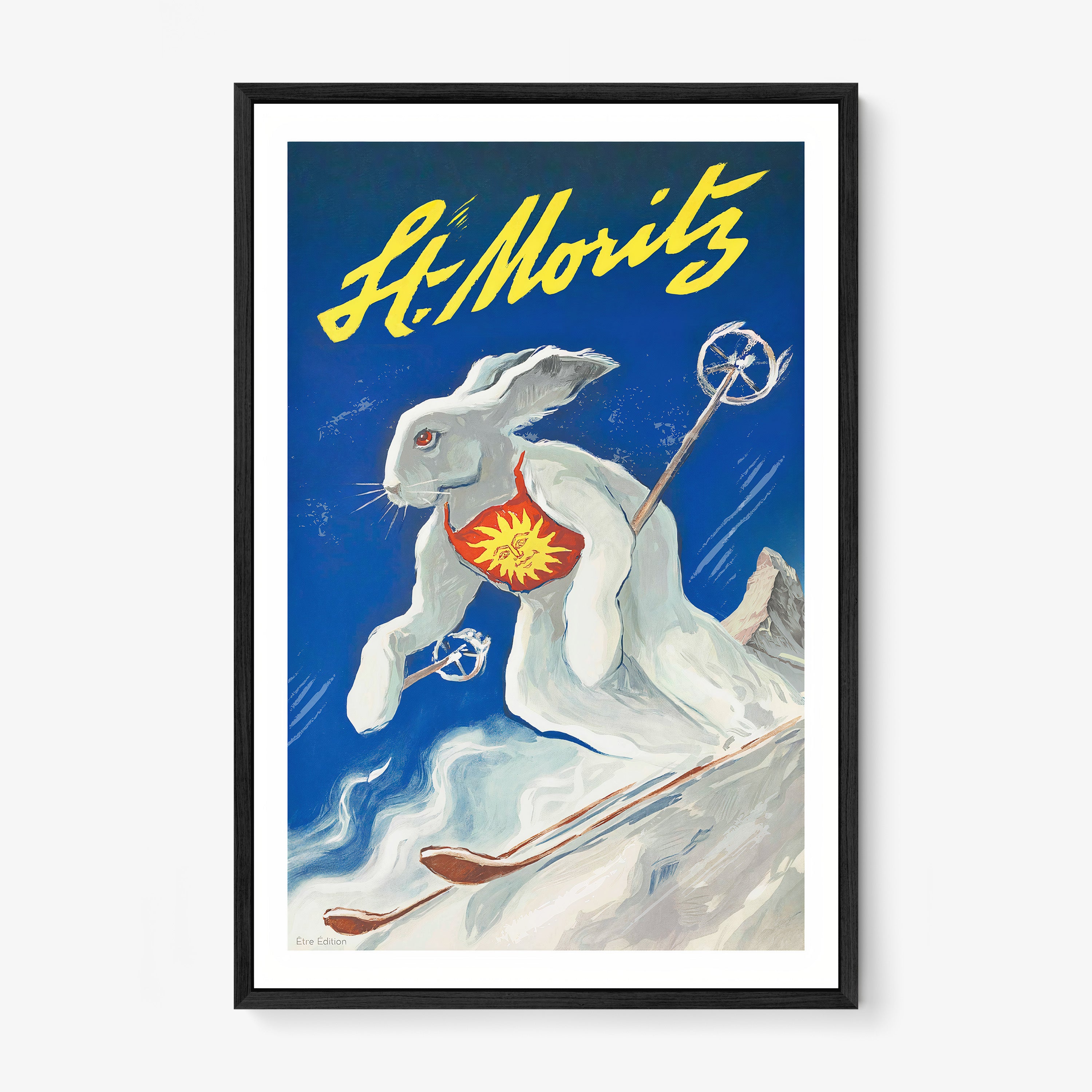 Framed poster of a white rabbit on skis with the text "St Moritz" at the top
