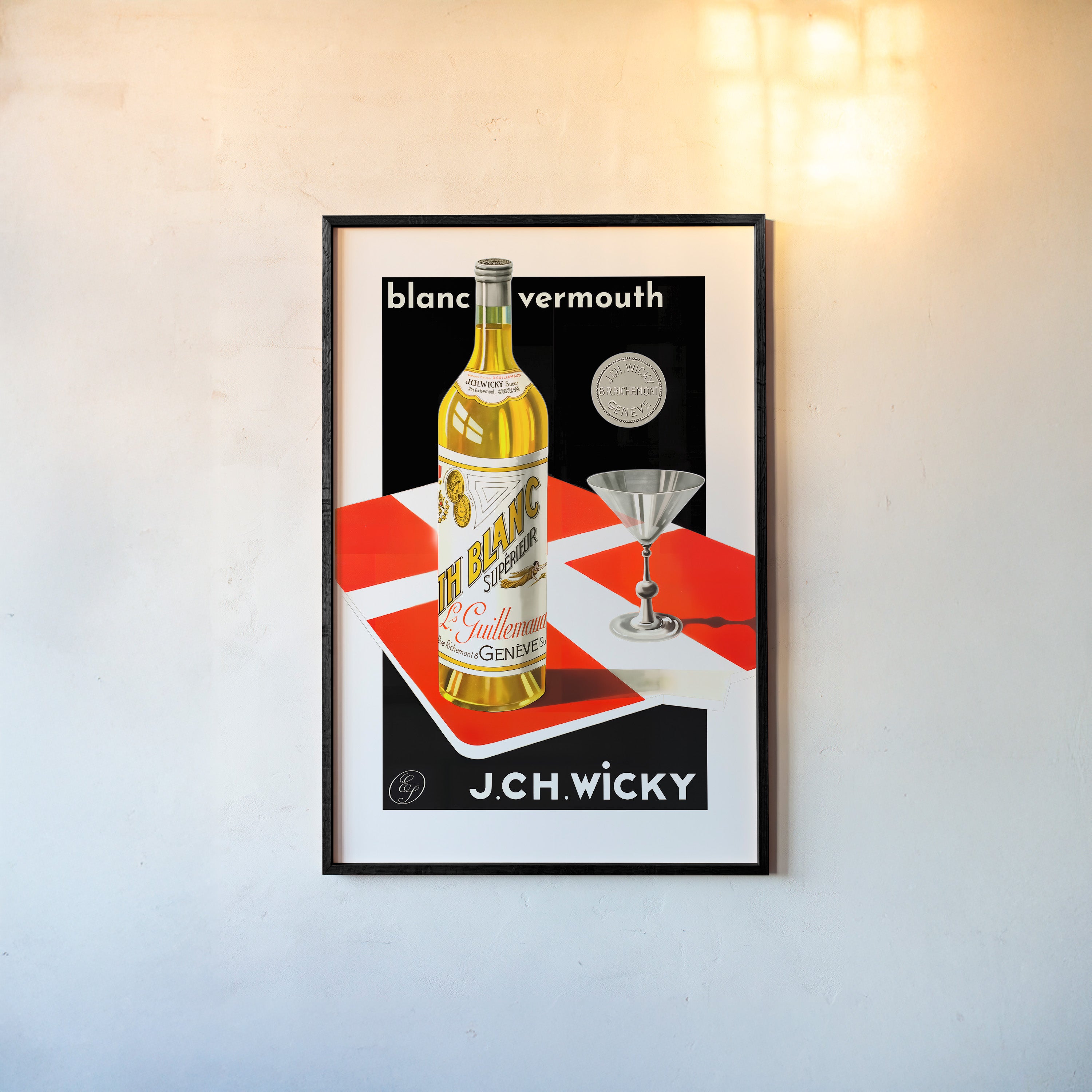 A framed poster features a bottle of vermouth and a cocktail glass in a bold graphic style